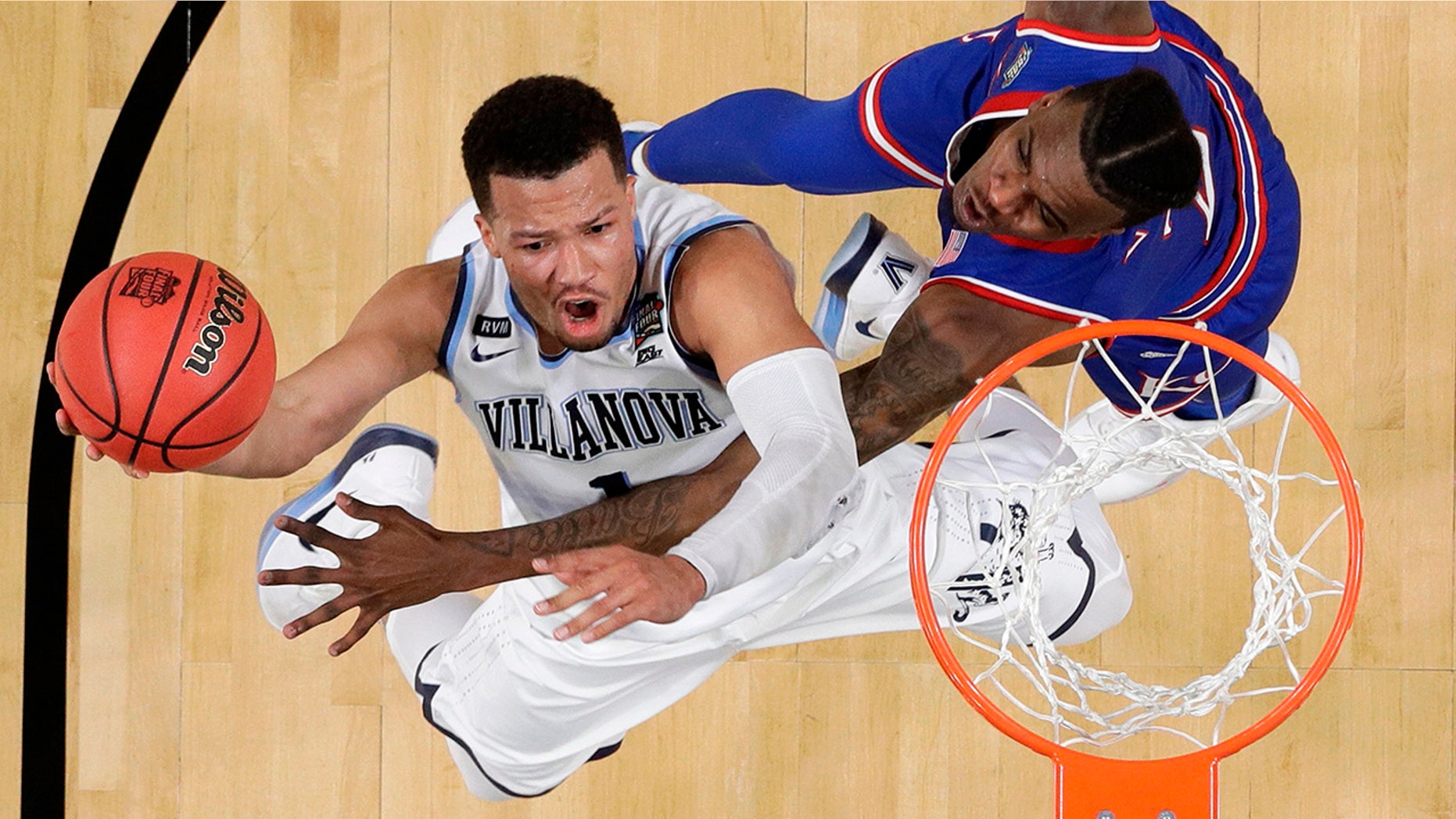 Villanova's Jalen Brunson (1) shoots over Kansas's Lagerald Vick (2) during the second half in the semifinals of the Final Four NCAA college basketball tournament, Saturday, March 31, 2018, in San Antonio.