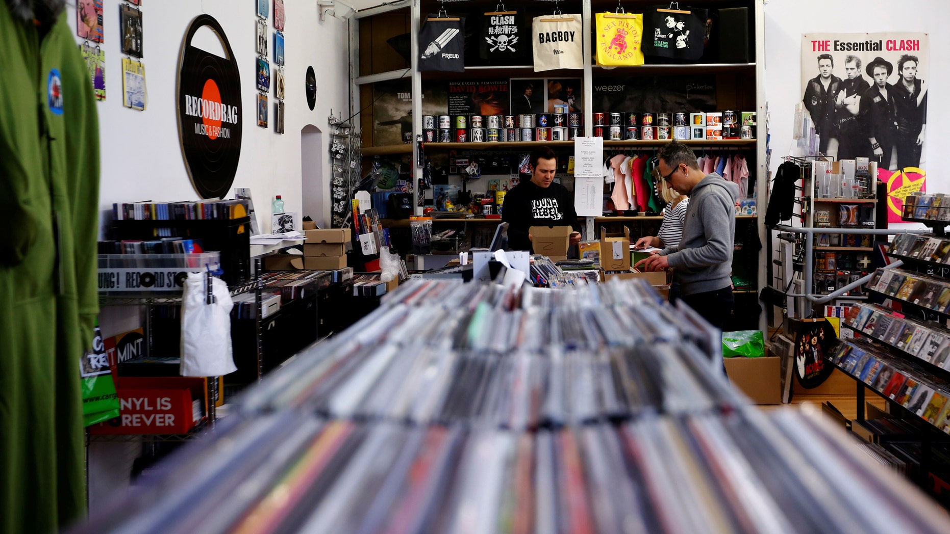 File photo: Employees check vinyl albums in the Recordbag shop ahead of the International Record Store day in Vienna, Austria, April 21, 2017. (REUTERS/Leonhard Foeger)