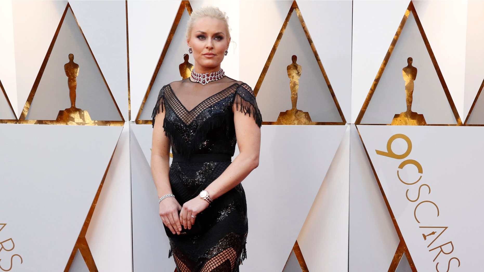 Skier Lindsey Vonn wears Christian Siriano on the Oscars red carpet.