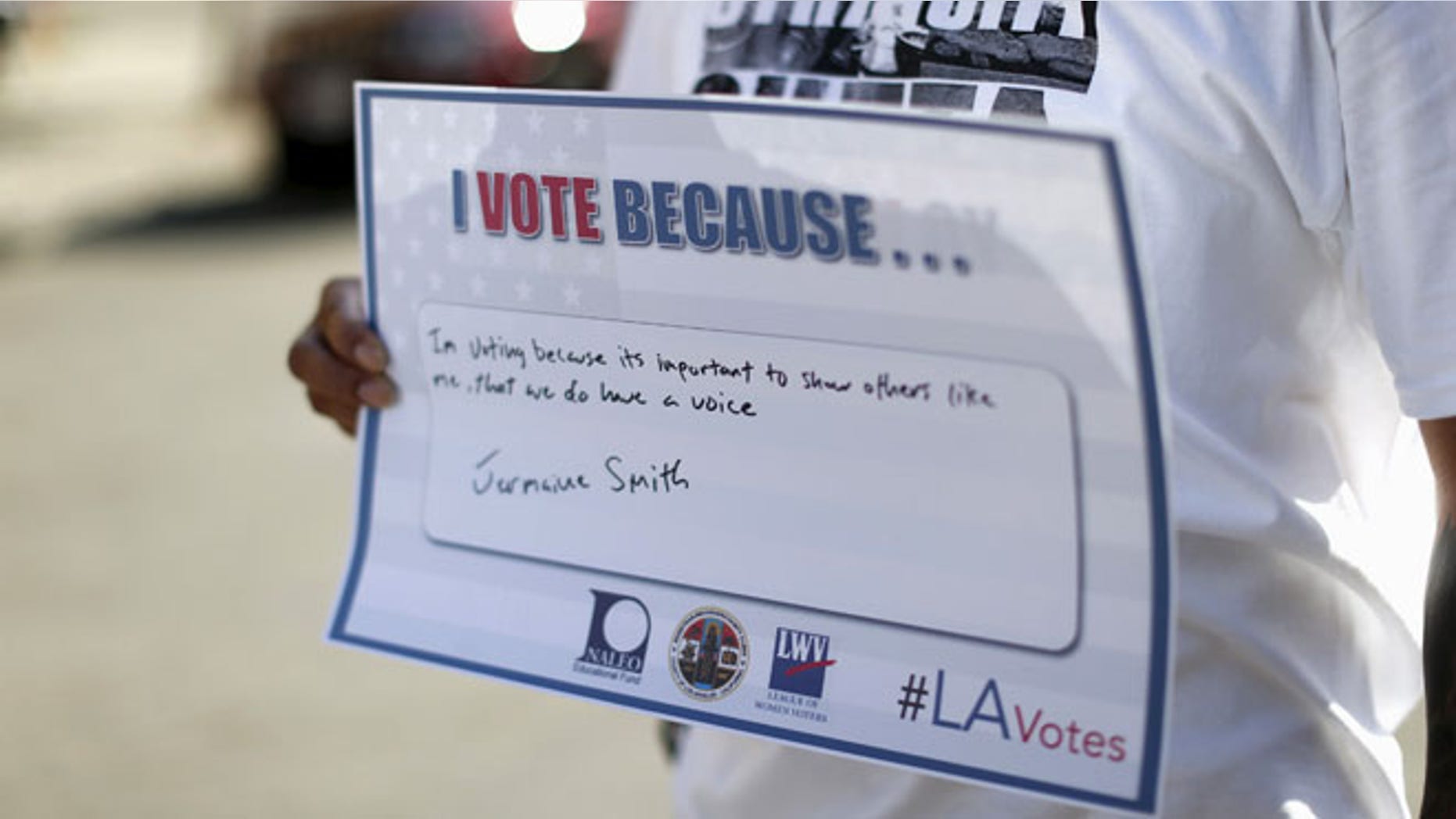 FILE: Sept. 22, 2015: A person holds a sign after registering to vote during National Voter Registration Day in Los Angeles, Calif. (Reuters)