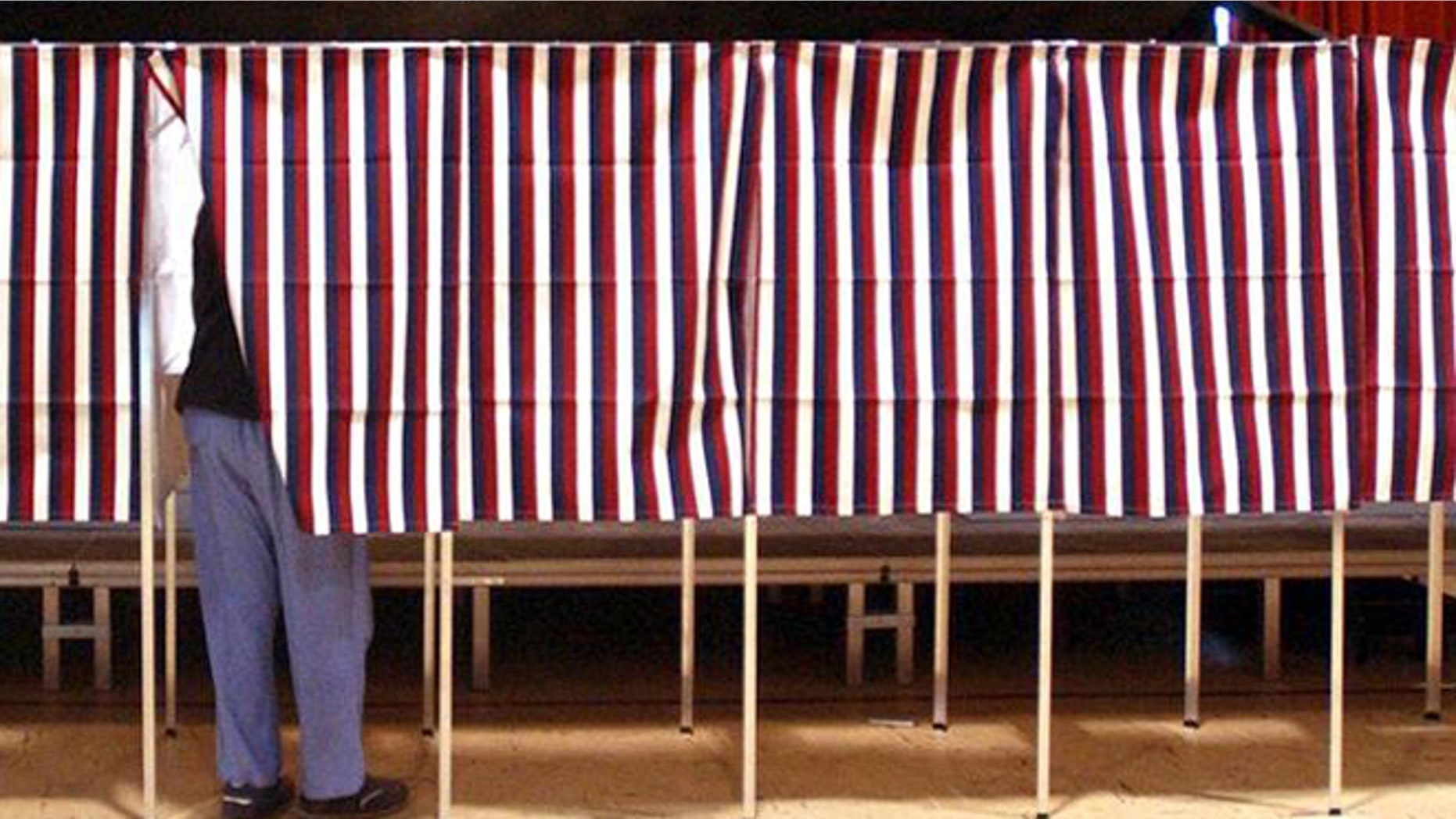 FILE: Feb. 2004: Voter in voting booth during Super Tuesday primary, Montpellier, Vt.