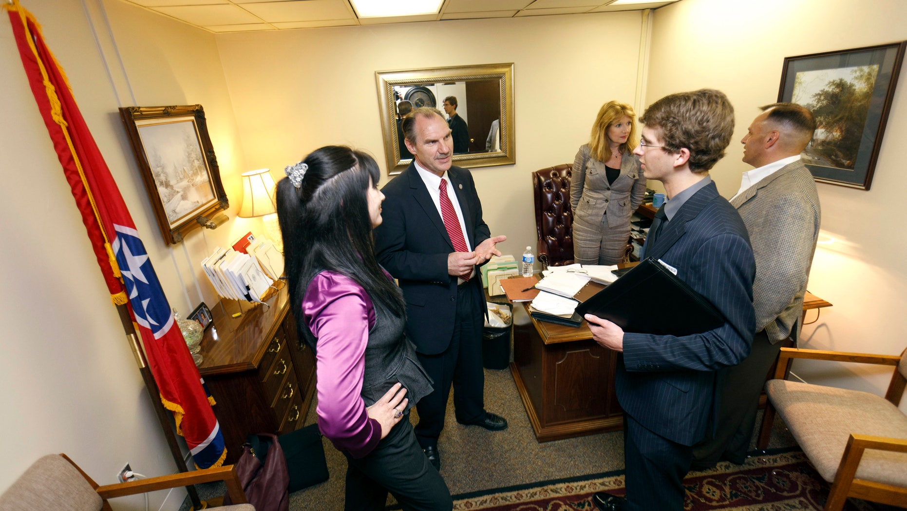 FILE: April 4, 2012: Members of the Tea Party and Young Republicans at Tennessee Technological University meet with Rep. Mark Pody in his office in Nashville, Tenn.