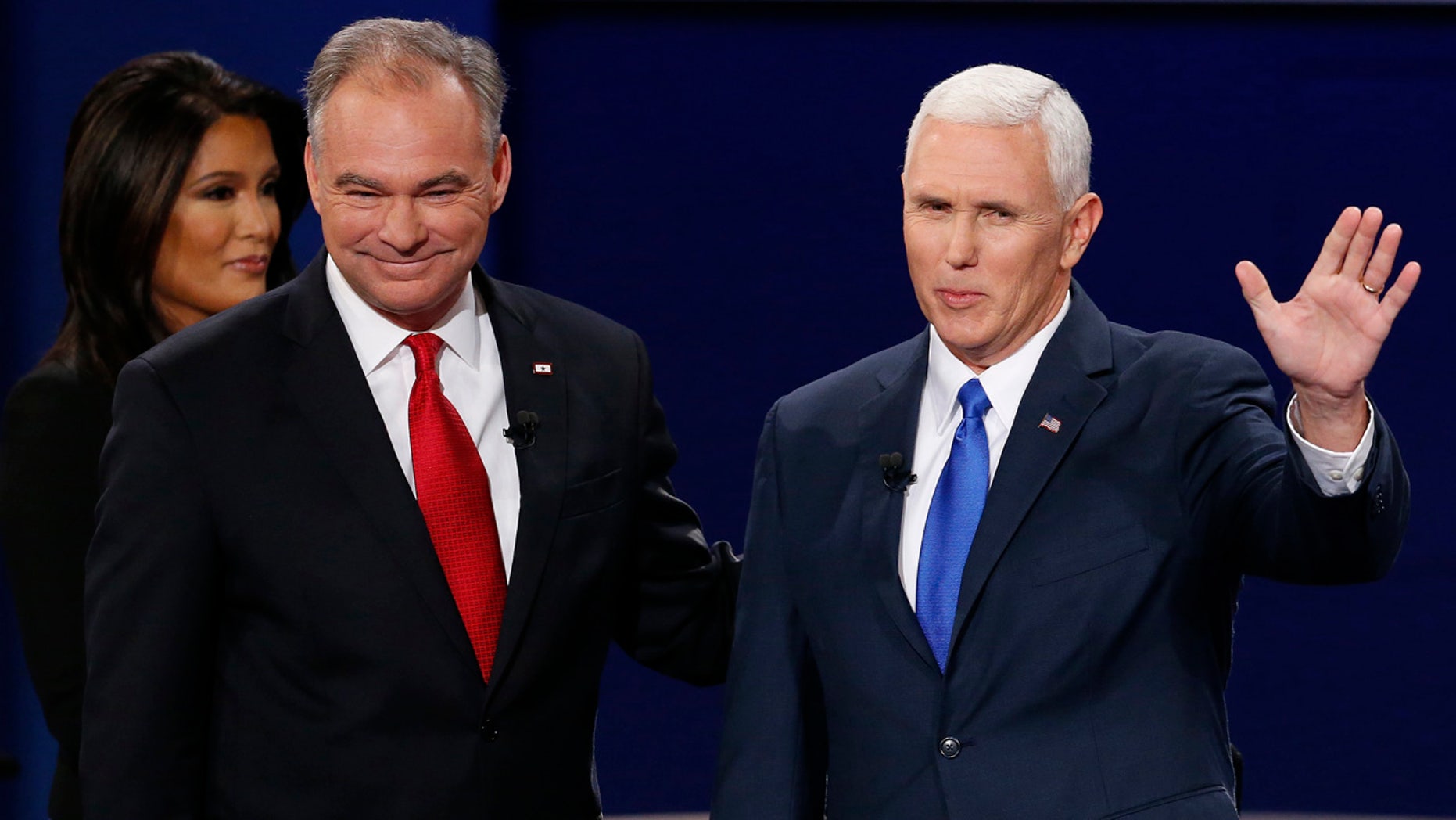 Republican vice-presidential nominee Gov. Mike Pence, right, and Democratic vice-presidential nominee Sen. Tim Kaine stand before the audience during the vice-presidential debate at Longwood University in Farmville, Va., Tuesday, Oct. 4, 2016. (AP Photo/Steve Helber)