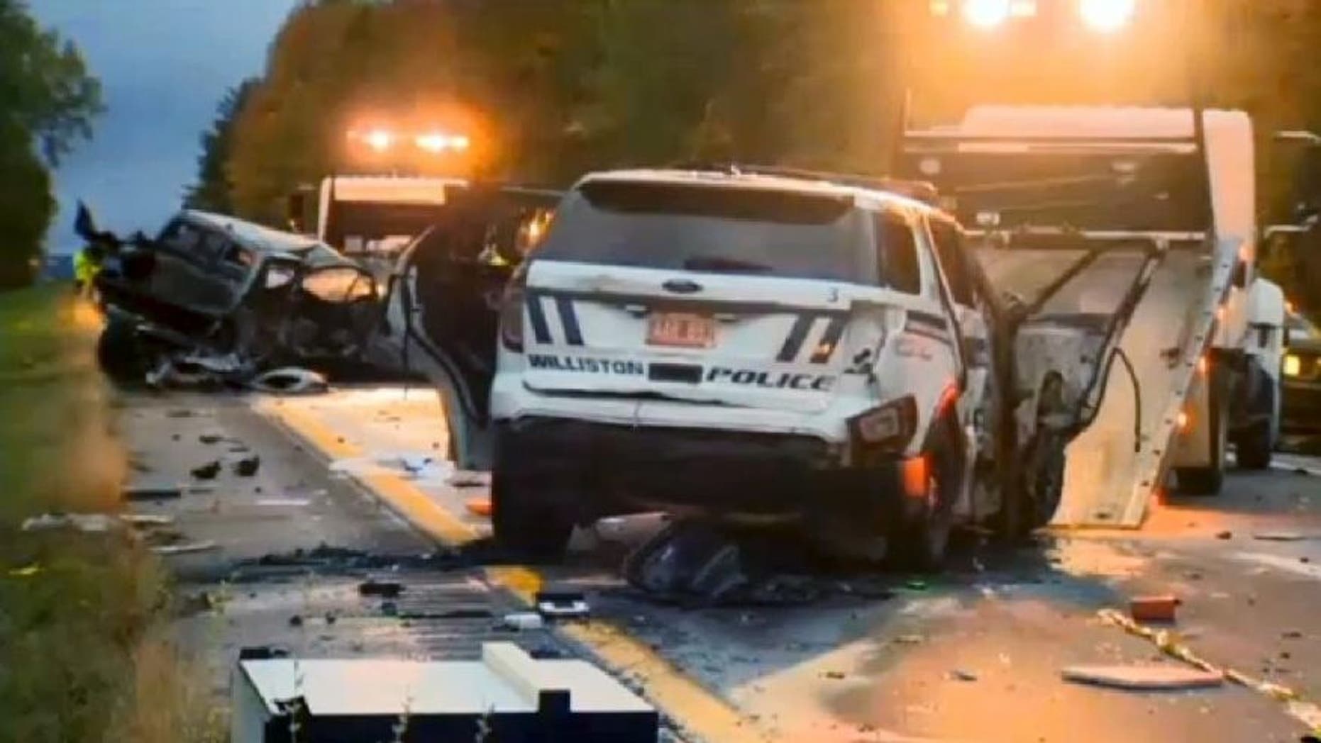 In this still image from video provided by WCAX-TV, workers remove vehicles from Interstate 89 early Sunday, Oct. 9, 2016, in Williston, Vt., after a wrong-way driver caused a crash just before midnight that killed multiple people, before stealing a police cruiser, striking several vehicles and injuring several people.