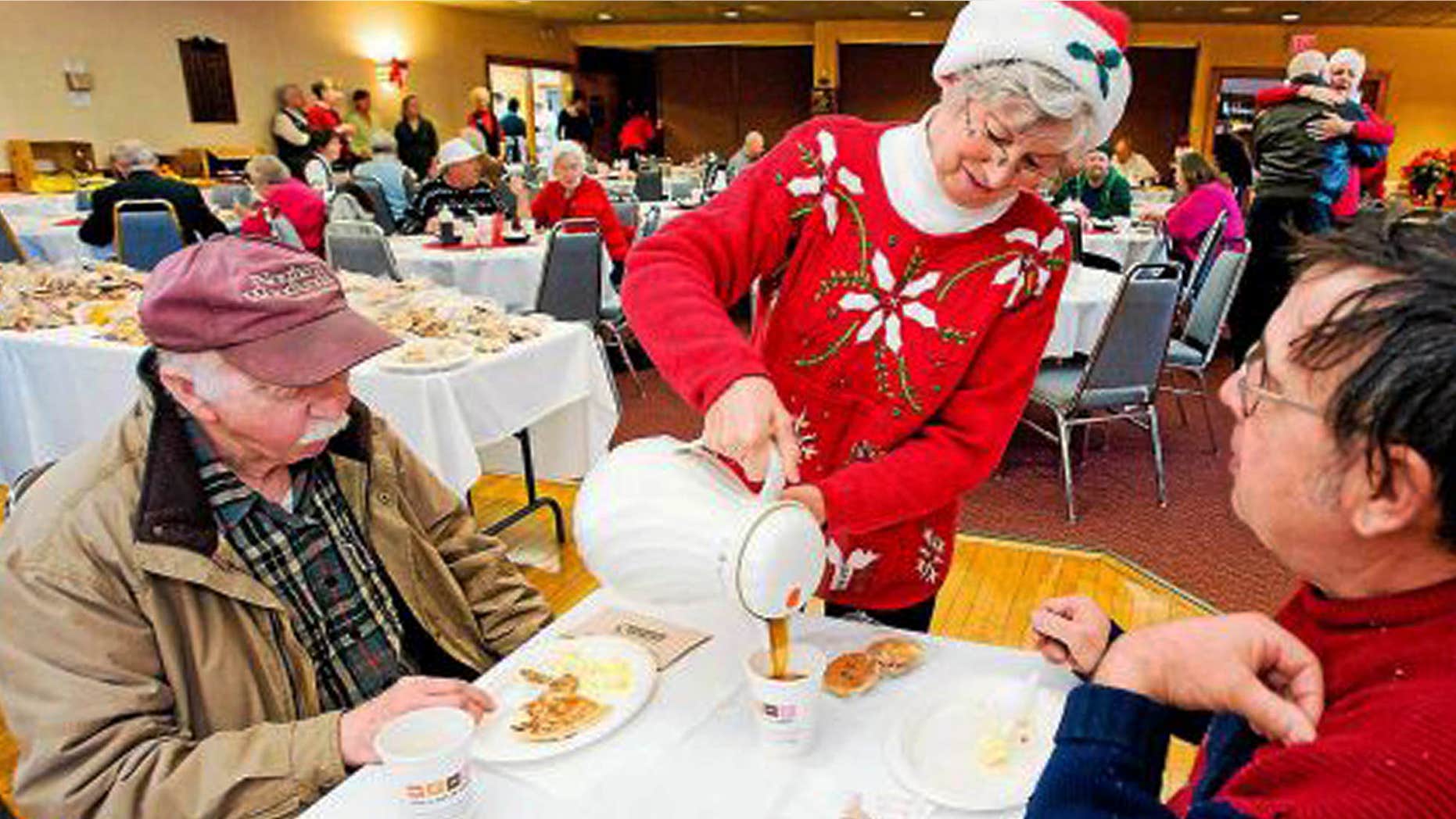 Dec. 2011: Connie Howe pours coffee for Ronald Read, left, and Dave Smith during the Charlie Slate Memorial Christmas breakfast at the American Legion.