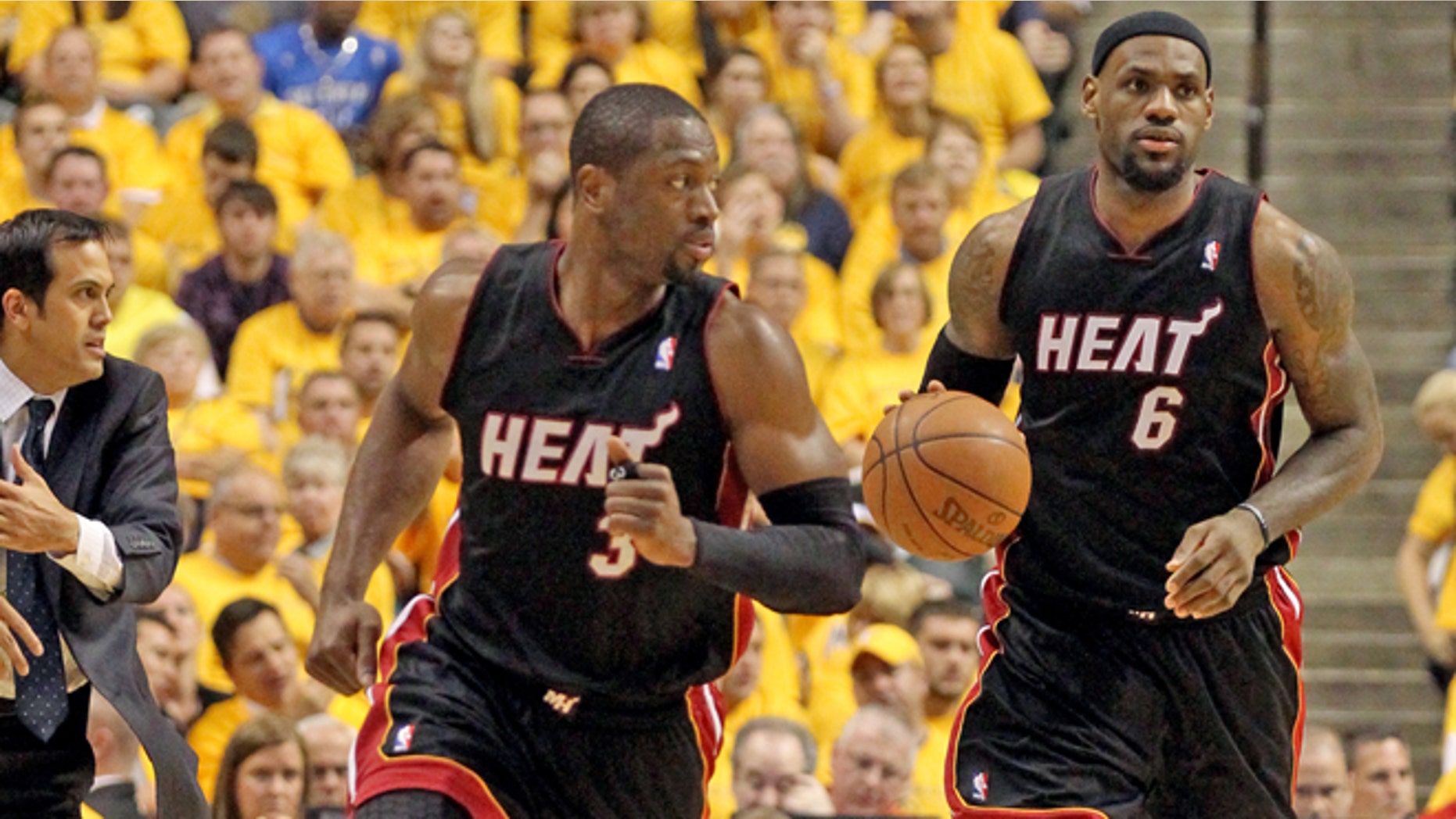 LeBron James drives the ball as Dwyane Wade leads in the third quarter. The Miami Heat vs Indiana Pacers for Game 6 of the Eastern Conference Semifinals at Bankers Life FieldHouse on Thursday, May 24, 2012. The Heat won 105-93 to win the series 4-2. (AP Photo/Al Diaz, Miami Herald)