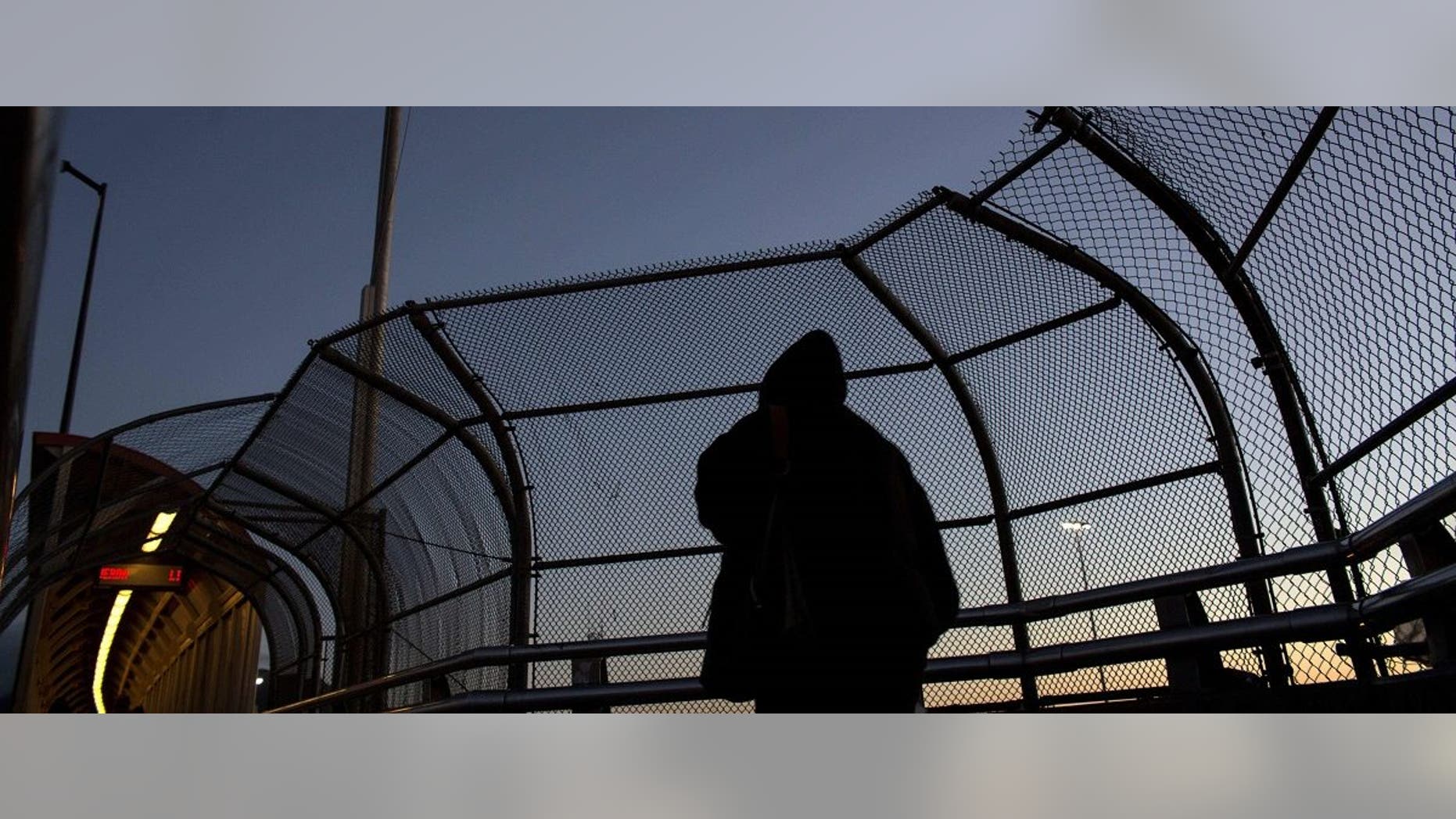 People walk to the United States at El Paso del Norte International Bridge on the US/Mexico border in Ciudad Juarez, on February 20, 2017, in northwestern Mexico. Guillermo Arias/AFP/Getty Images.