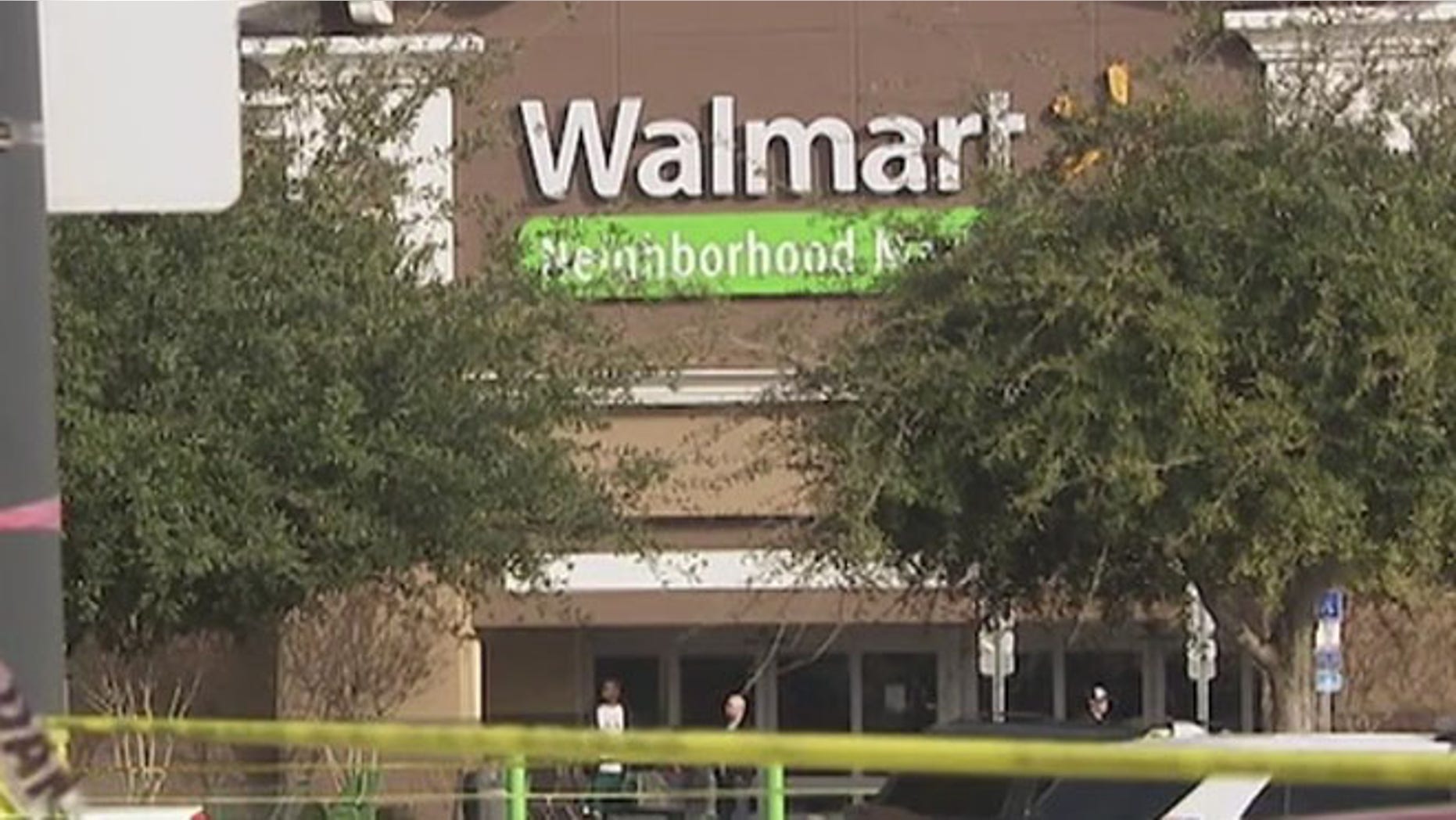 Police tape in front of the Pine Hills Walmart Saturday.