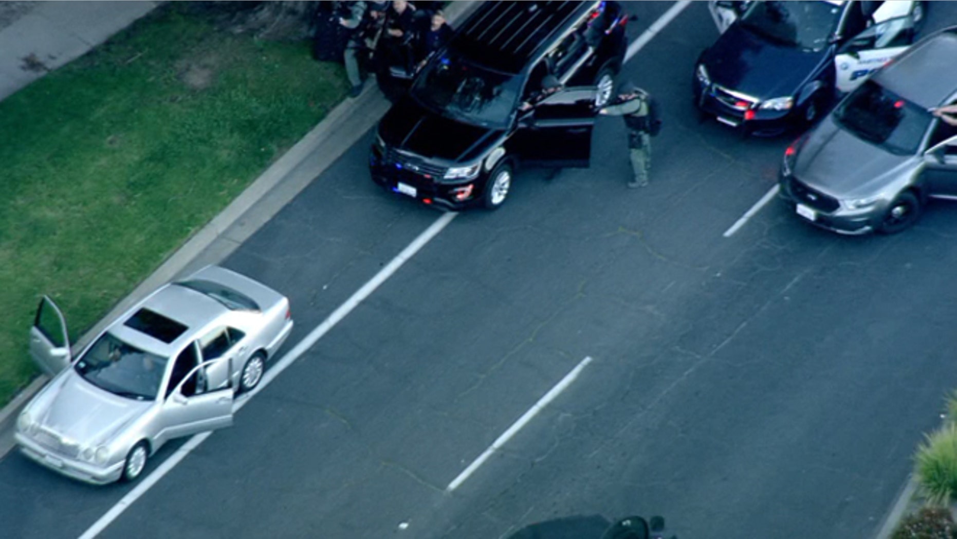Police surrounded a vehicle being driven they say by a man wanted in the shooting death of a woman Thursday in Walnut Creek, Calif.