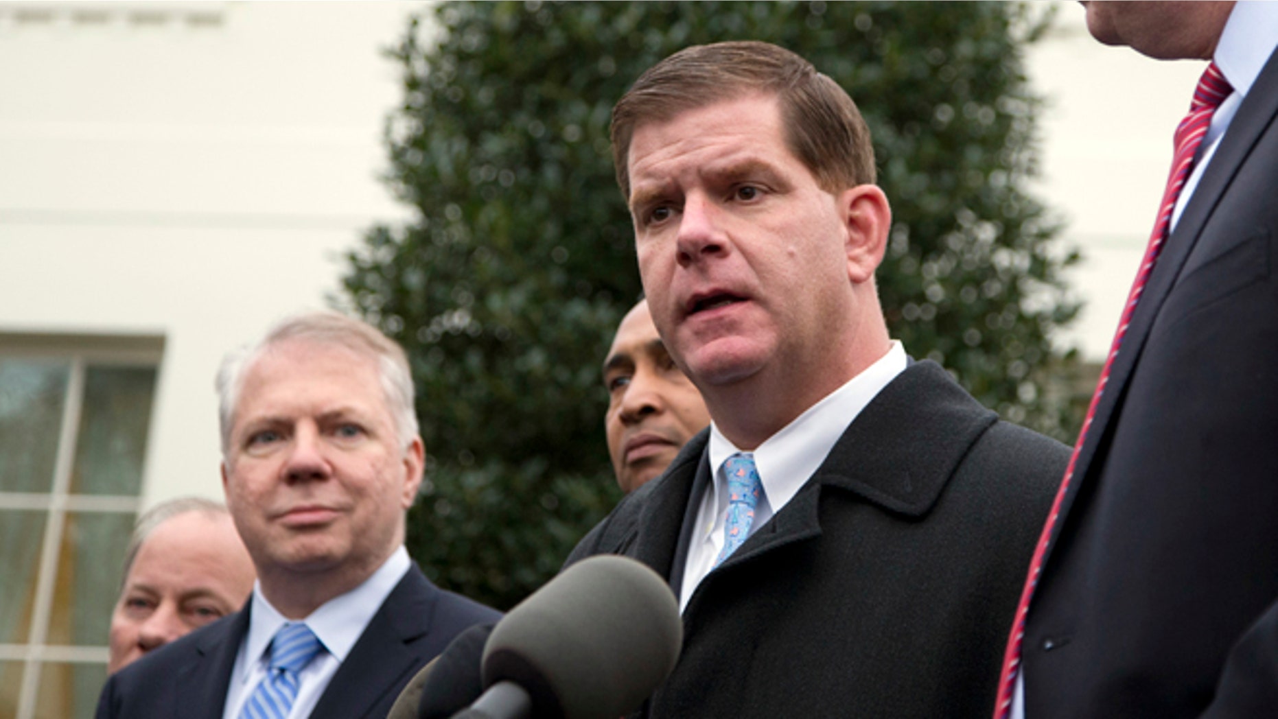 Dec. 13, 2013: Boston Mayor-elect Martin Walsh, center, speaks outside the West Wing of the White House after a meeting between newly-elected mayors and President Obama.