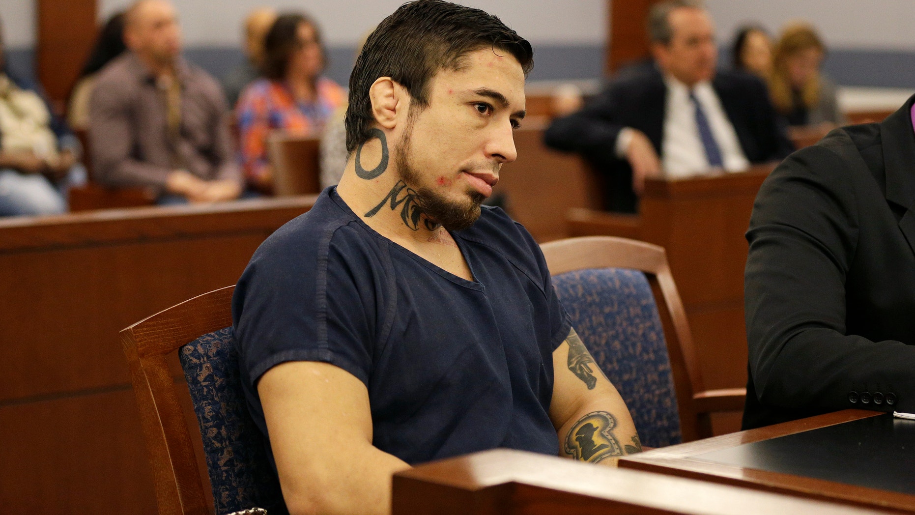 FILE - In this Nov. 14, 2014, file photo, Jonathan Paul Koppenhaver, also known as War Machine, appears in court for a preliminary hearing in Las Vegas. Koppenhaver is accused of assaulting his former girlfriend Christine Mackinday, also known as Christy Mack. A judge on Tuesday, Dec. 2, 2014 revoked probation for Koppenhaver, the former mixed martial arts fighter War Machine on a prior felony conviction while he awaits trial on charges that could get him life without parole for allegedly trying to kill Mackinday, his porn actress ex-girlfriend and her friend. The judge invoked a 1½-to-4 years sentence she suspended in Feb. 2012 after Koppenhavers guilty plea in a felony attempted battery case. (AP Photo/John Locher, File)