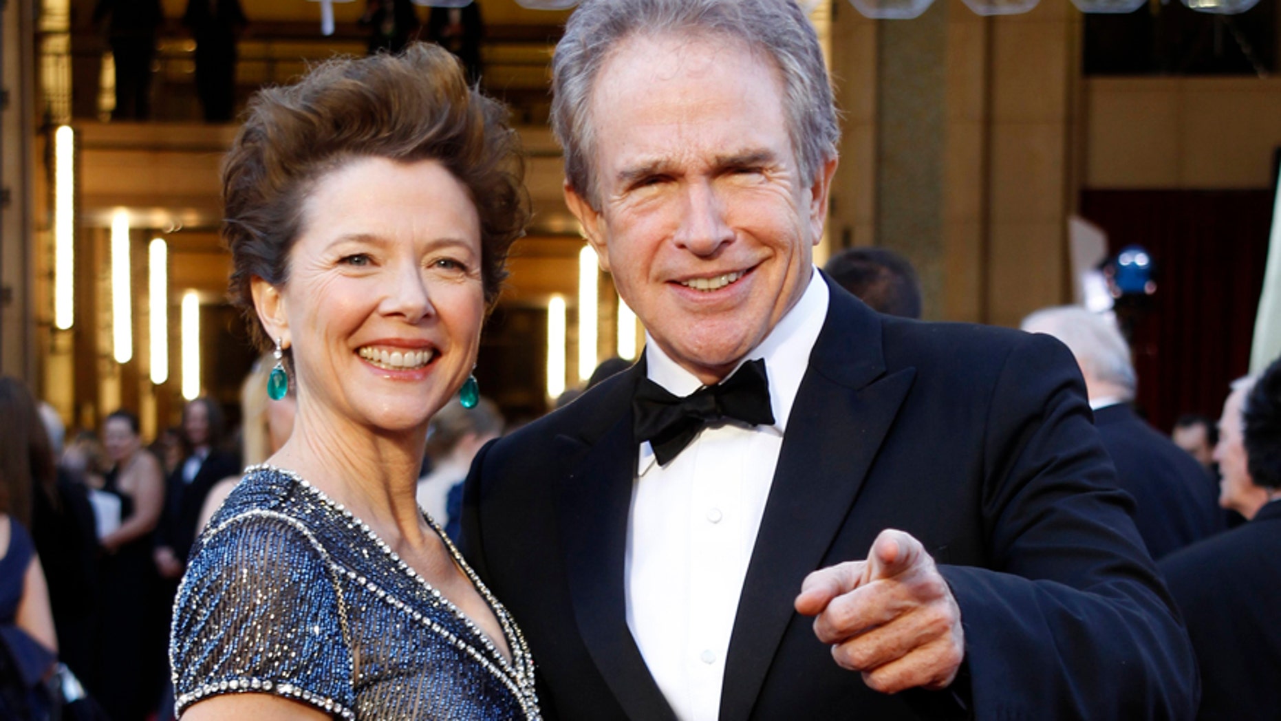 Annette Bening and husband Warren Beatty arrive at the 83rd Academy Awards in Hollywood, California, February 27, 2011.