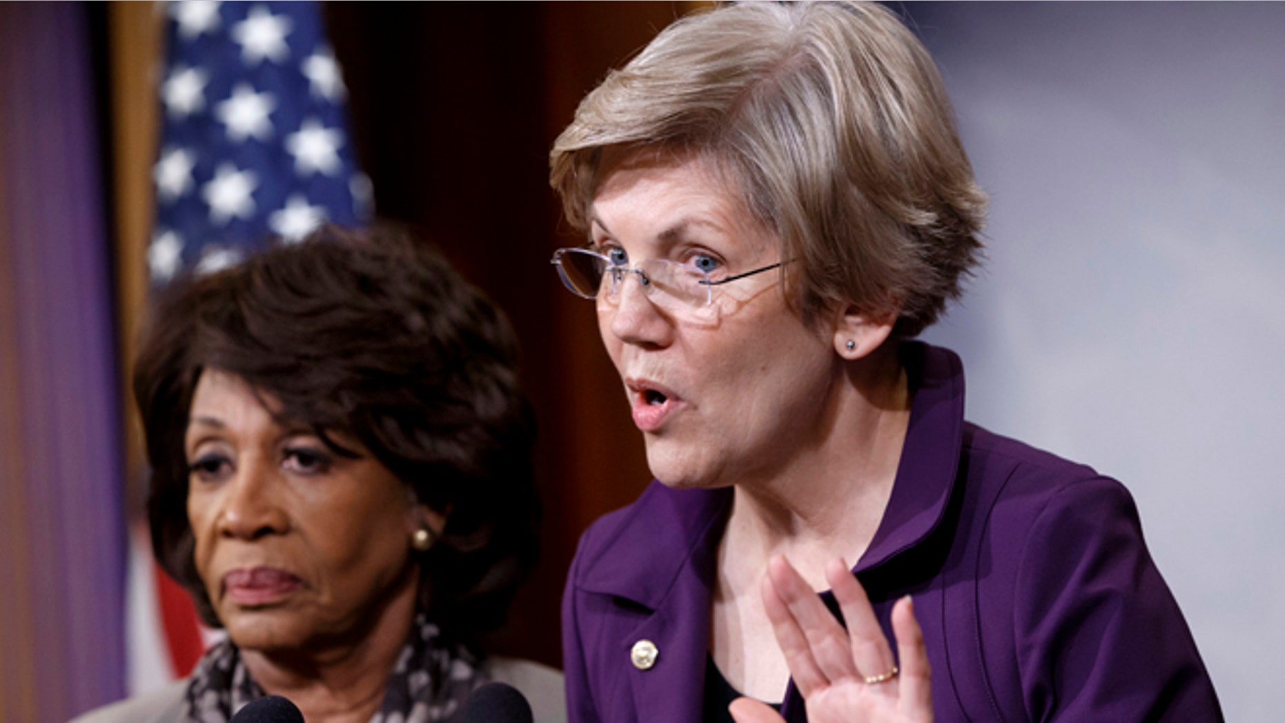 Dec. 10, 2014: Sen. Elizabeth Warren, D-Mass., a member of the Senate Banking Committee, right, and Rep. Maxine Waters, D-Calif., ranking member of the House Financial Services Committee, express their outrage to reporters that a huge, $1.1 trillion spending bill approved by the Republican-controlled House yesterday contains changes to the 2010 Dodd-Frank law that regulates complex financial instruments known as derivatives.