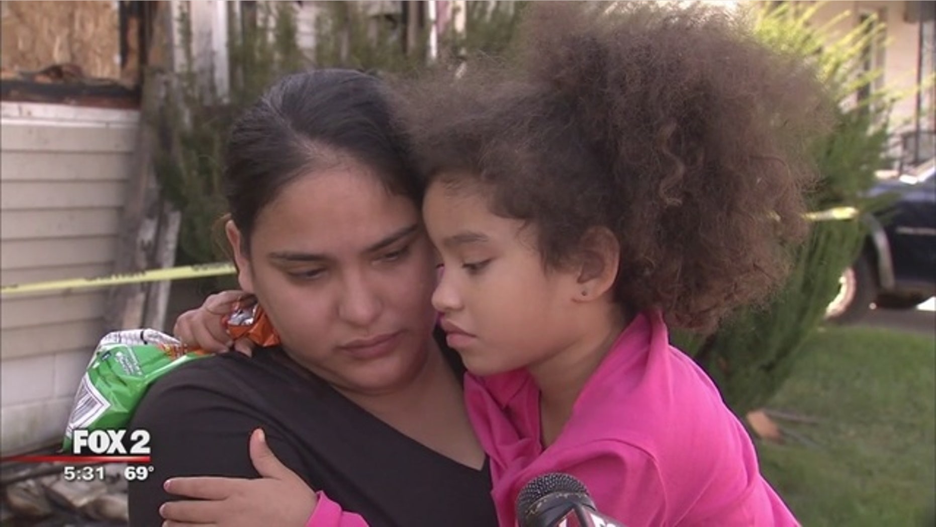 Rosa Conley with her daughter, Jamirah, who saved the family from a fire.