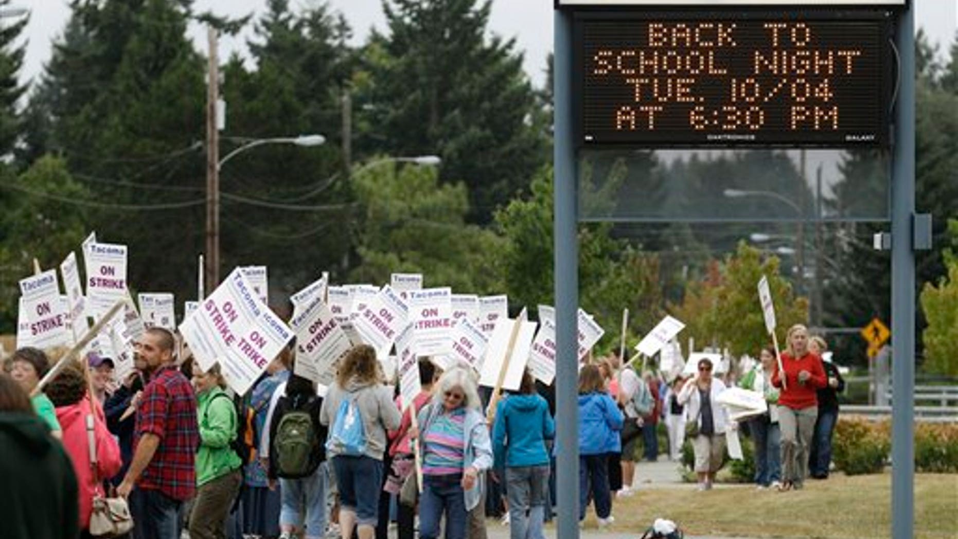 Sept. 13: Striking teachers picket outside Wilson High School next to a sign announcing an upcoming back-to-school night, in Tacoma, Wash. School was closed for 28,000 students Tuesday after teachers in Washington state's third-largest school district voted to strike Monday night.