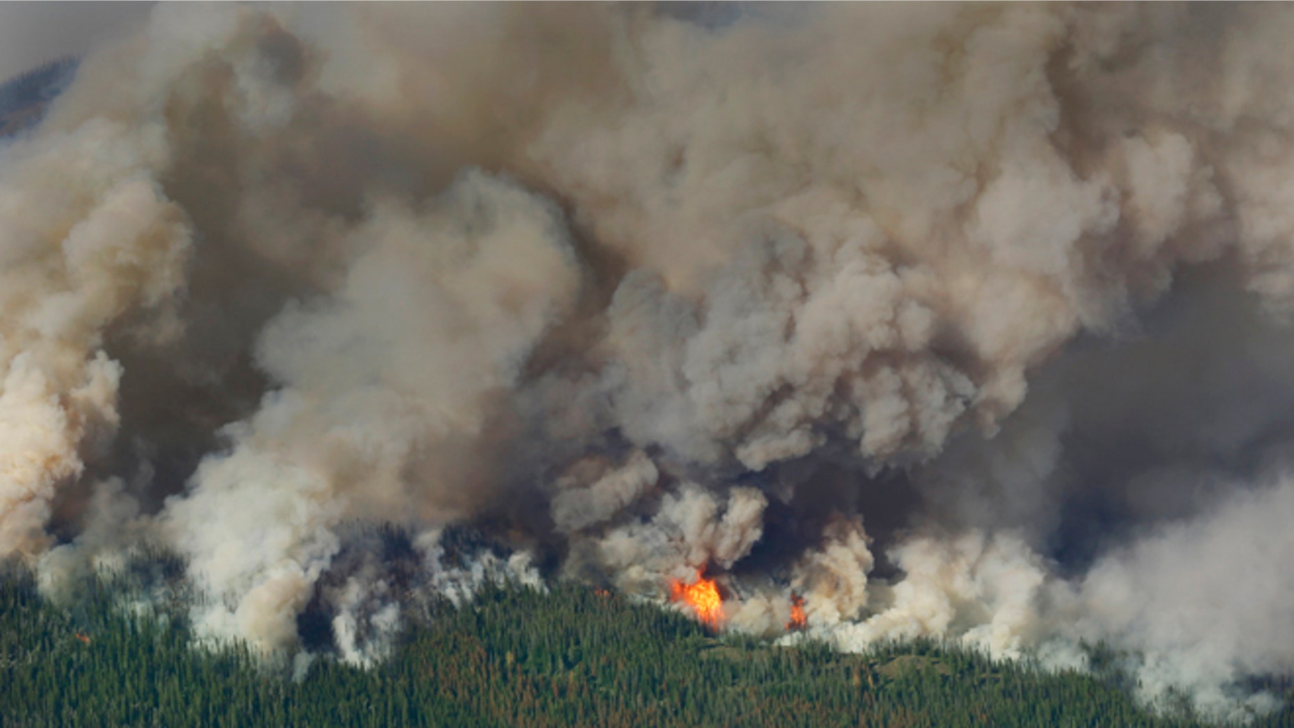 July 17, 2014: Smoke and flames rise from the Chiwaukum Creek Fire near Leavenworth, Wash.