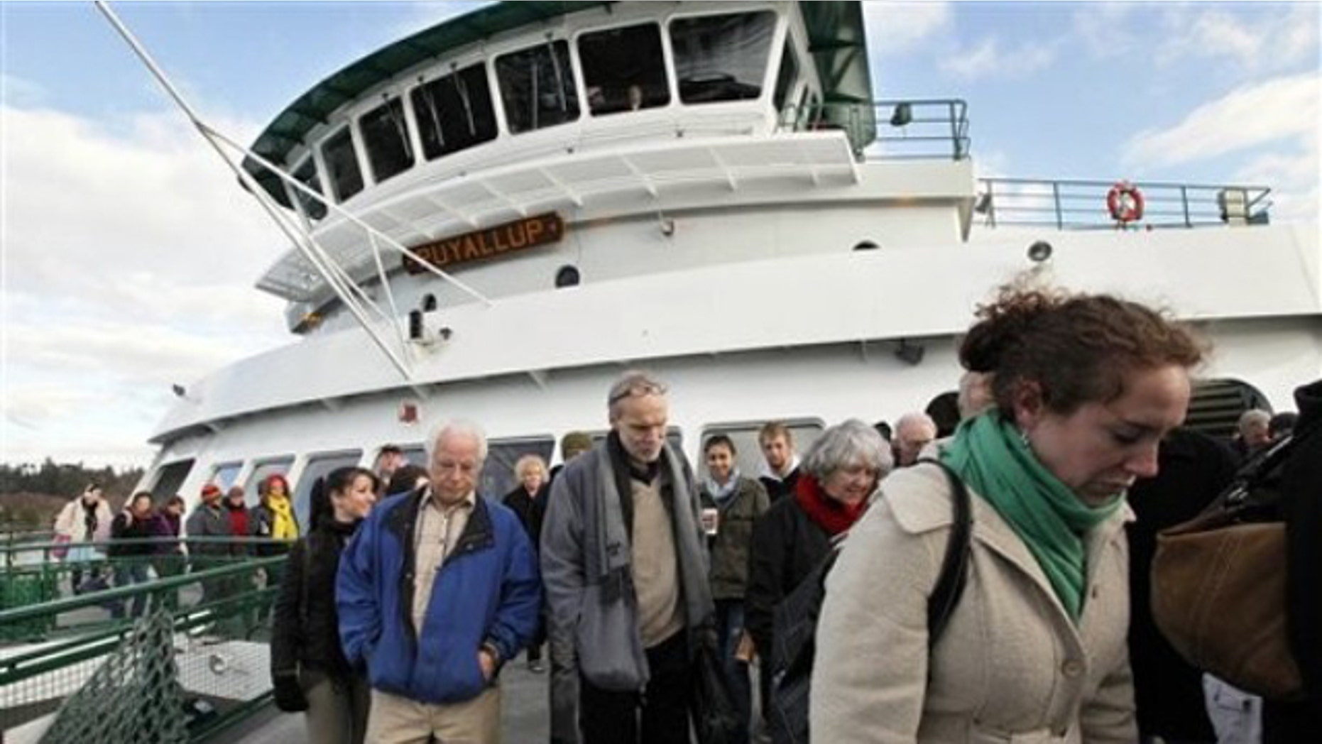 Dec. 21, 2011: Passengers disembark from the Washington state ferry Puyallup on its arrival on Bainbridge Island, Wash.