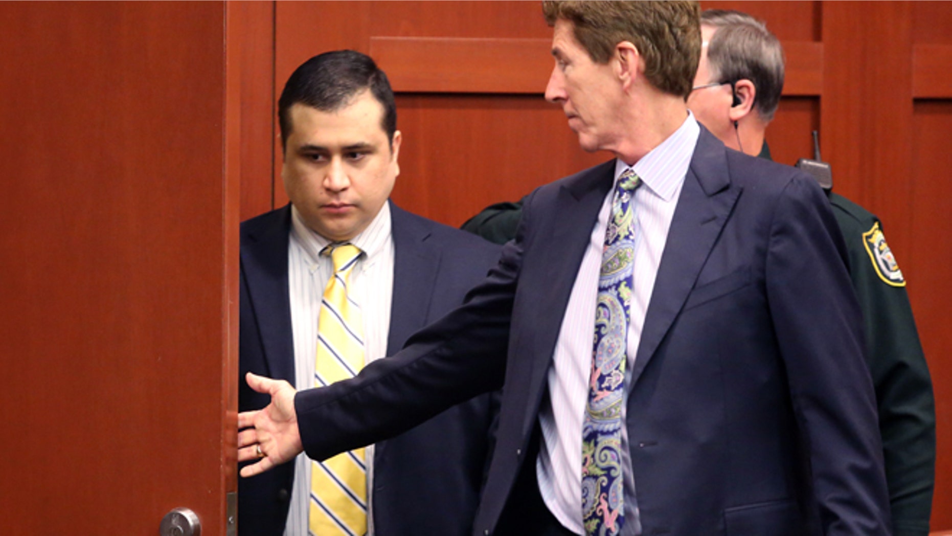 George Zimmerman, defendant in the killing of Trayvon Martin, arrives with his attorney Mark O'Mara, right, for a pre-trial hearing, Tuesday, April 30, 2013 in Seminole circuit court, in Sanford, Fla. Zimmerman, the former neighborhood watch leader, told Circuit Judge Debra Nelson that he agrees with his defense attorneys' decision not to seek an immunity hearing under the state's "Stand Your Ground" self-defense law. Zimmerman has pleaded not guilty, claiming self-defense. Martin was fatally shot in February 2012 during a fight with Zimmerman in a Sanford gated community. (AP Photo/Orlando Sentinel, Joe Burbank, Pool)