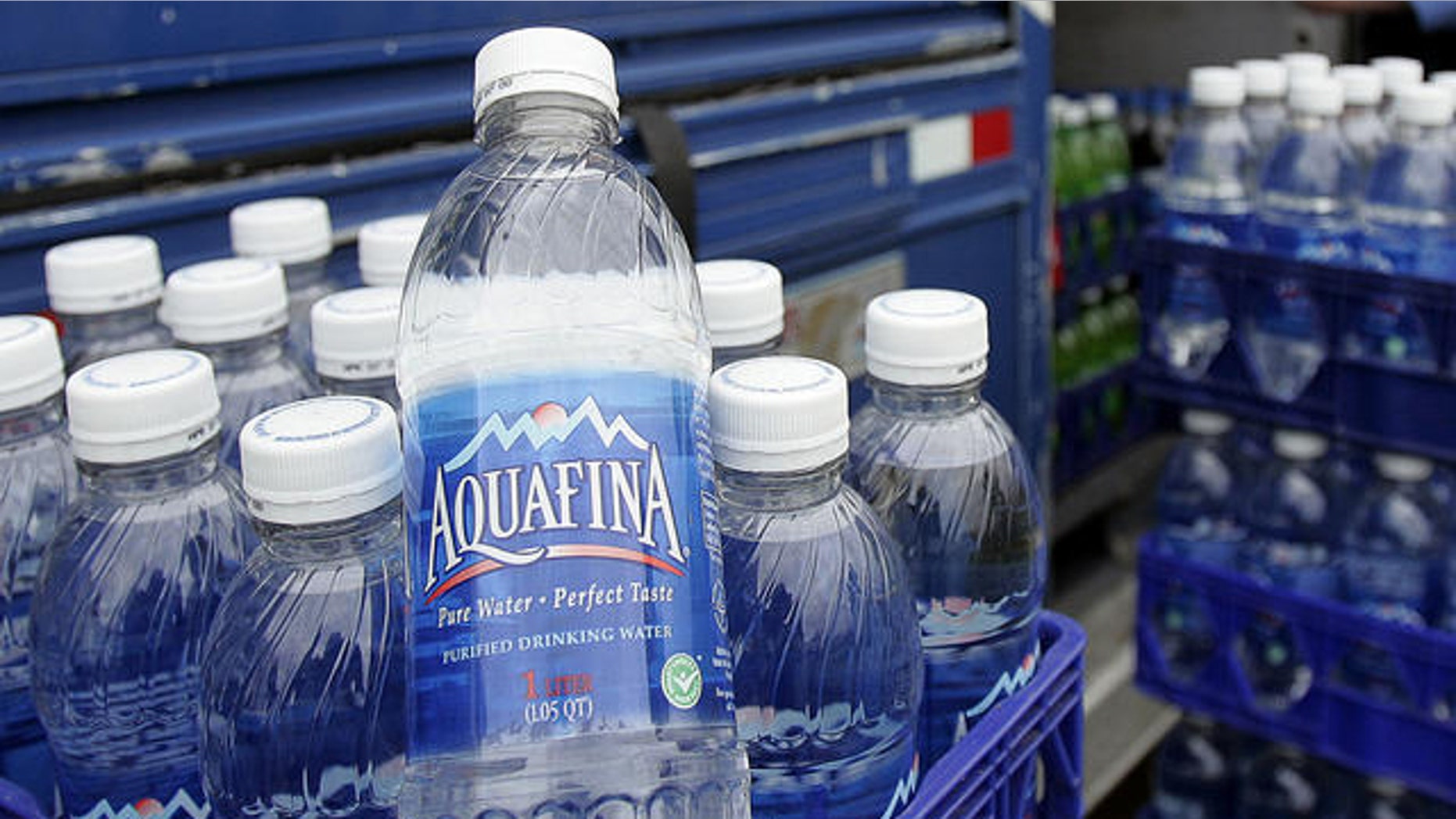 Pepsico delivery man Nick Jones unloads Aquafina water and other Pepsi products while makiing a delivery in Tualatin, Ore., Wednesday, April 26, 2006. PepsiCo Inc., the world's No. 2 soft-drink maker and owner of snack-maker Frito-Lay, on Wednesday said first-quarter profit jumped as revenue across all its divisions grew, aided by a growth in sales of snacks and beverages marketed as healthier fare.(AP Photo/Don Ryan)