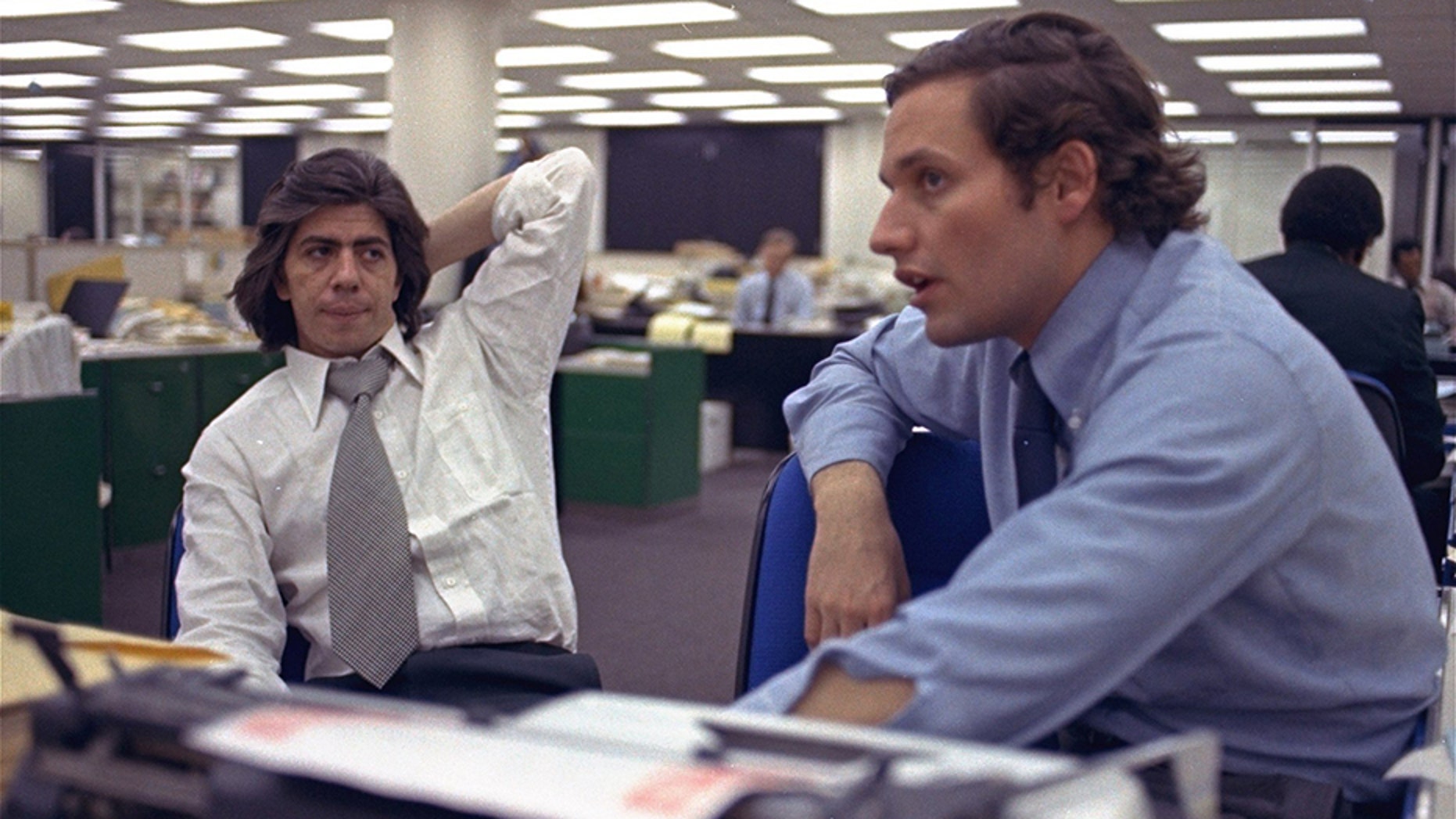 Reporters Bob Woodward, right, and Carl Bernstein, whose reporting of the Watergate case won a Pulitzer Prize, sitting in the newsroom of the Washington Post in 1973.
