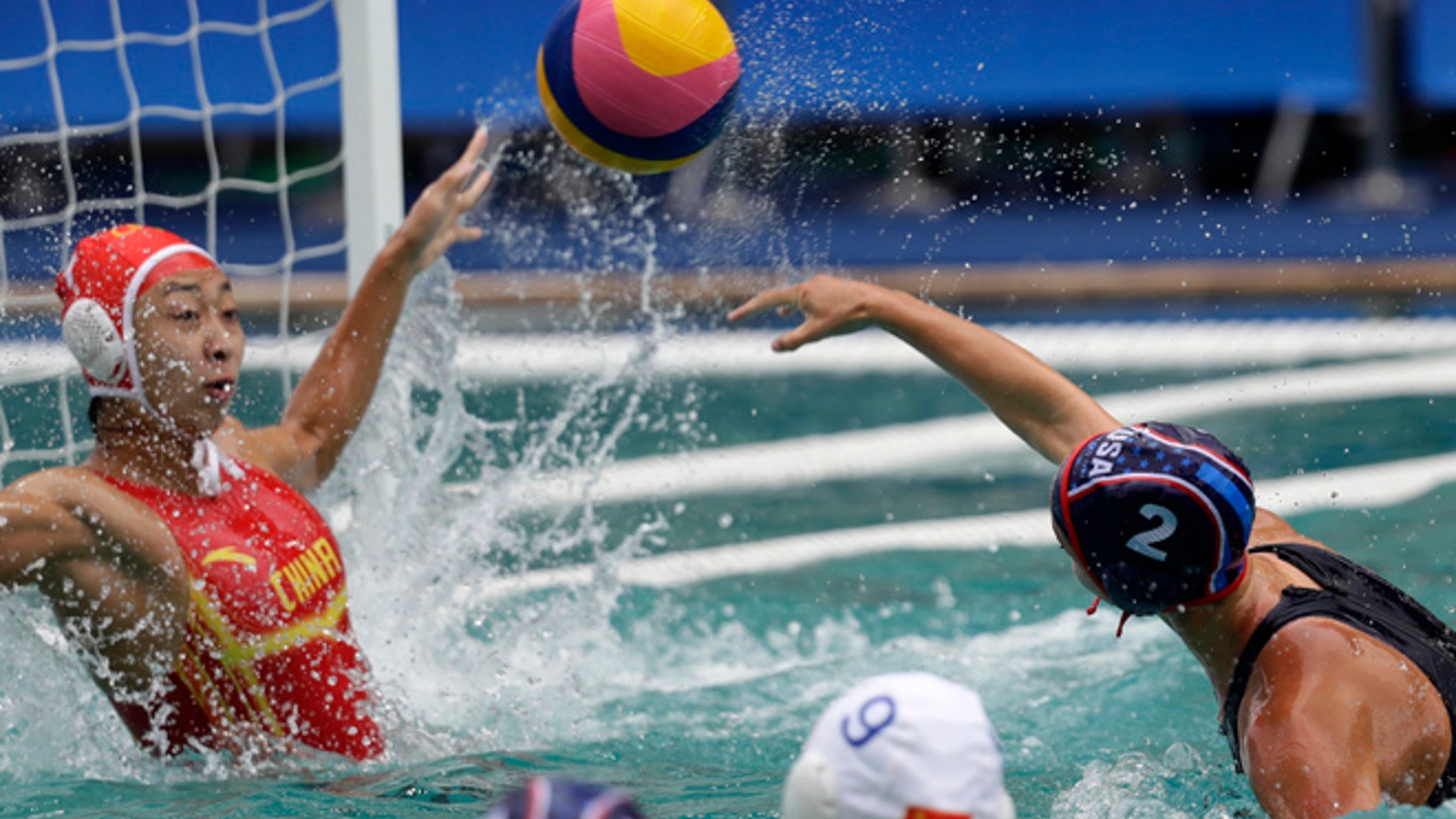 United States' Madeline Musselman, right, shoots and scores against China during women's water polo preliminary round match at the 2016 Summer Olympics in Rio de Janeiro, Brazil, Thursday, Aug. 11, 2016.