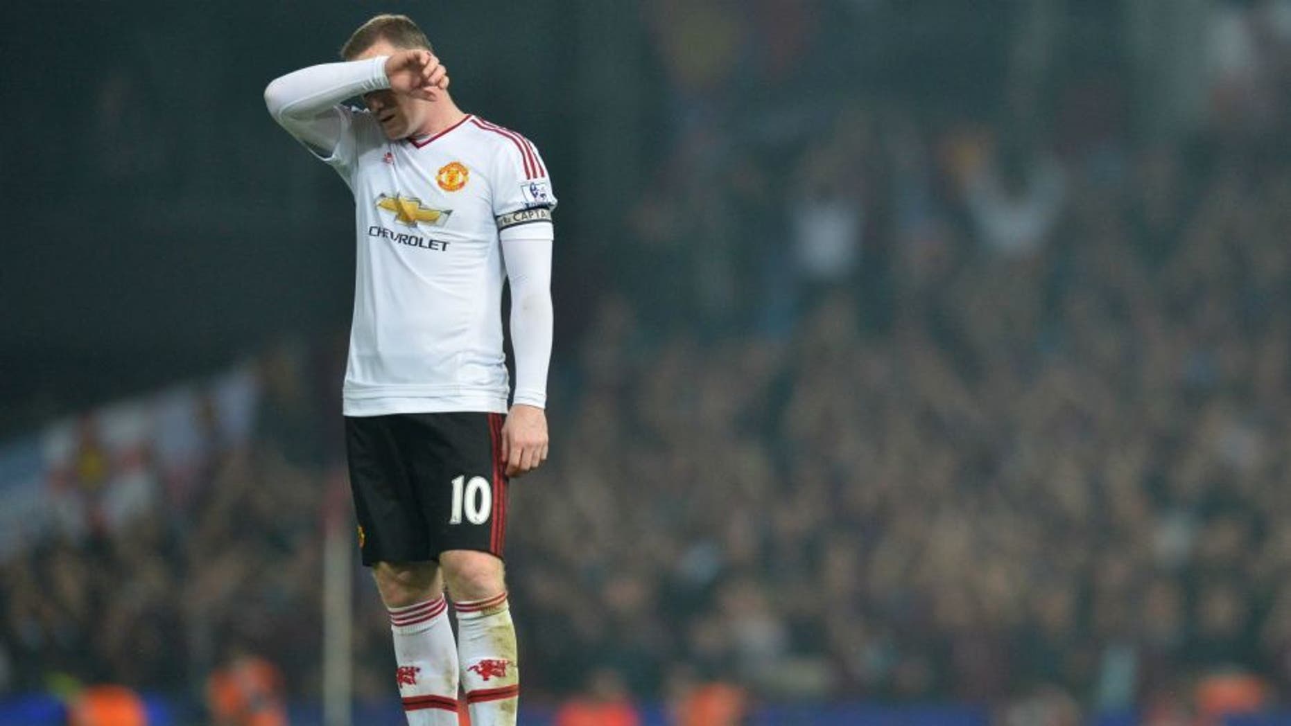 Manchester United's English striker Wayne Rooney reacts after losing the English Premier League football match between West Ham United and Manchester United at The Boleyn Ground in Upton Park, in east London on May 10, 2016. / AFP / GLYN KIRK / RESTRICTED TO EDITORIAL USE. No use with unauthorized audio, video, data, fixture lists, club/league logos or 'live' services. Online in-match use limited to 75 images, no video emulation. No use in betting, games or single club/league/player publications. / (Photo credit should read GLYN KIRK/AFP/Getty Images)