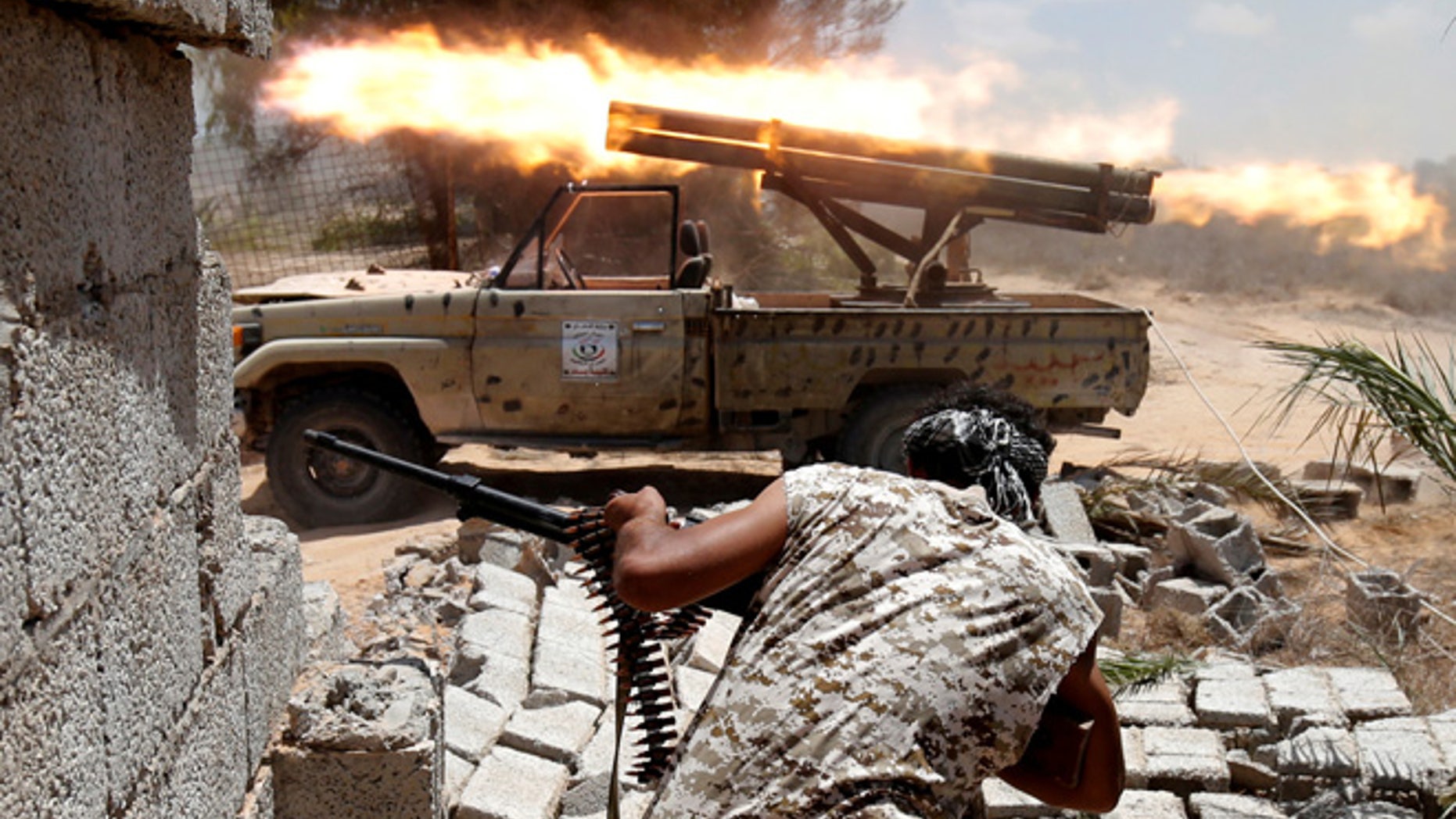 July 31: Libyan forces allied with the U.N.-backed government fire weapons during a battle with ISIS fighters in Sirte.