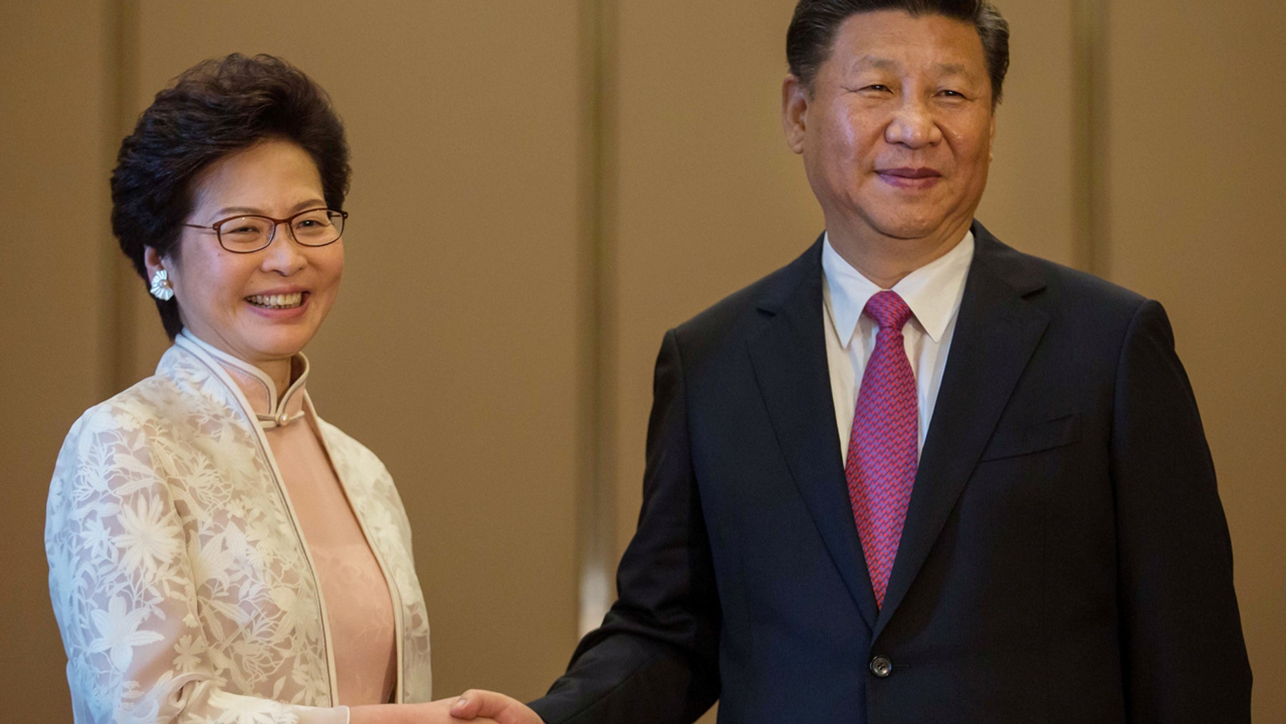 JULY 1: China's President Xi Jinping shakes hands with Hong Kong's Incoming Chief Executive Carrie Lam ahead of a meeting in Hong Kong.