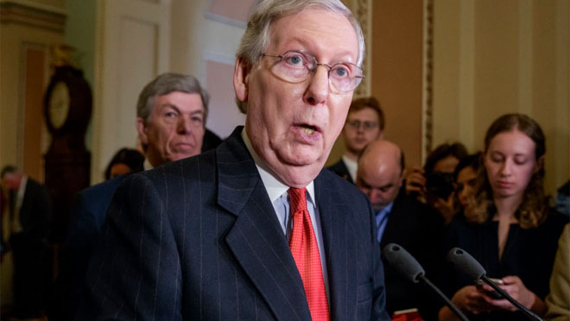 Senate Majority Leader Mitch McConnell of Ky. speaks with reporters following a closed-door strategy session.