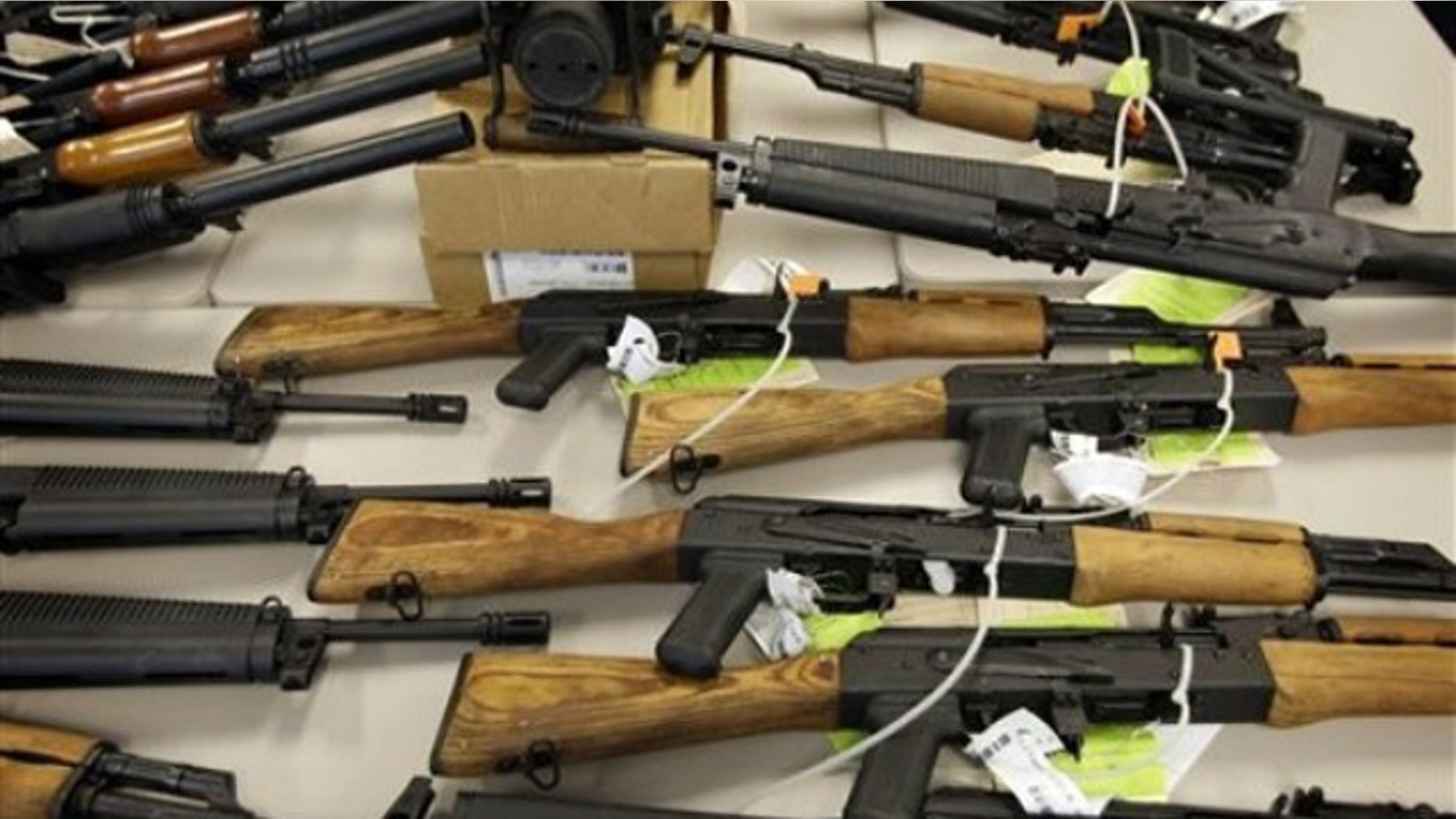 FILE: Jan. 25, 2011: Part of a cache of seized weapons displayed at a news conference in Phoenix.