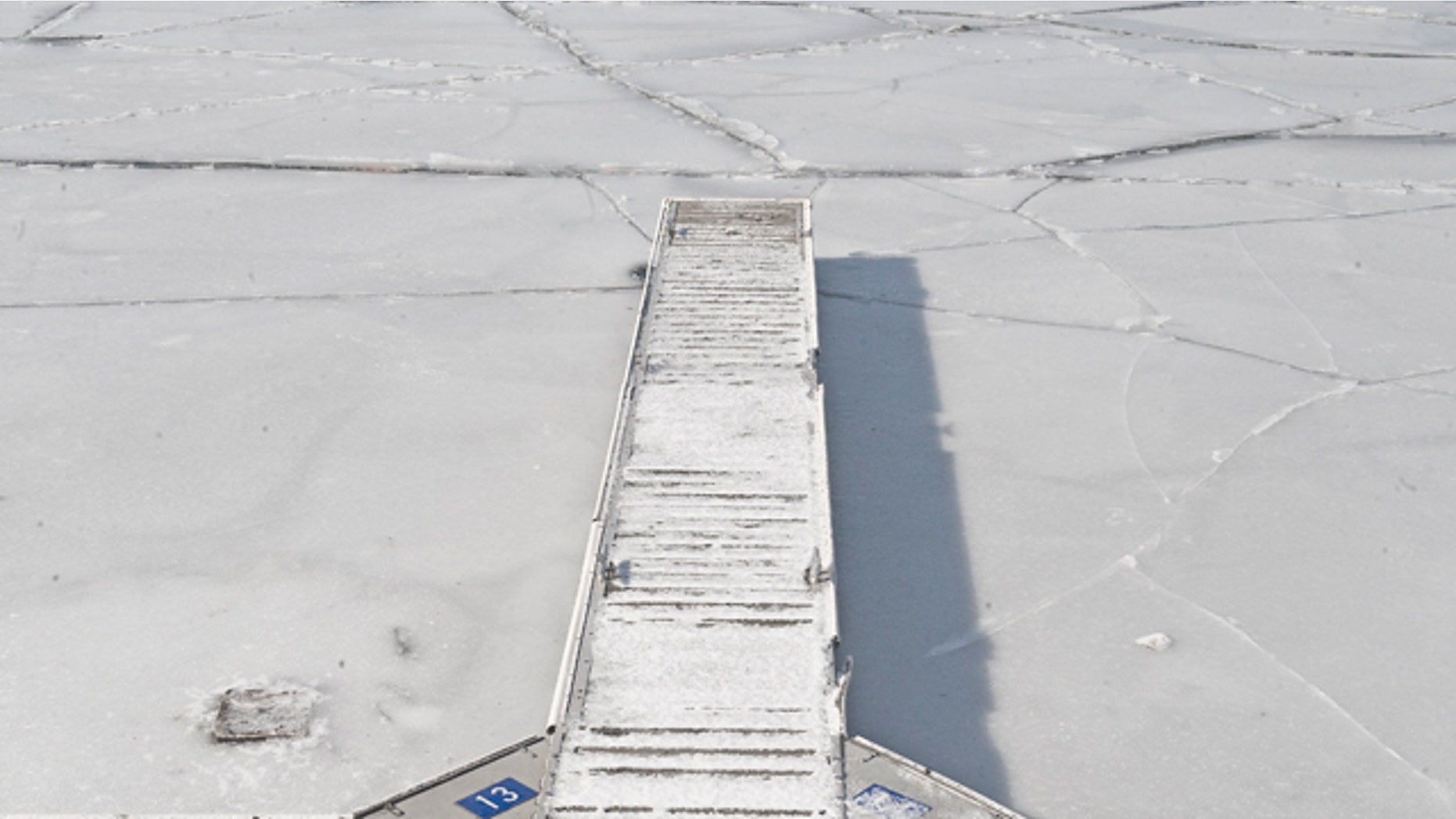 Jan. 23: A boat dock is shown in the frozen waters of the Delaware River in Camden, N.J. Gusty winds in the Garden State are bringing Arctic cold air that is expected to last into the early part of next week. (AP/Camden Courier-Post)