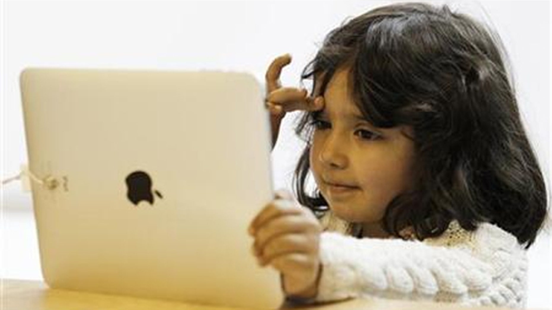 A girl views a new iPad tablet computer at an Apple store during its UK launch in central London May 28, 2010.