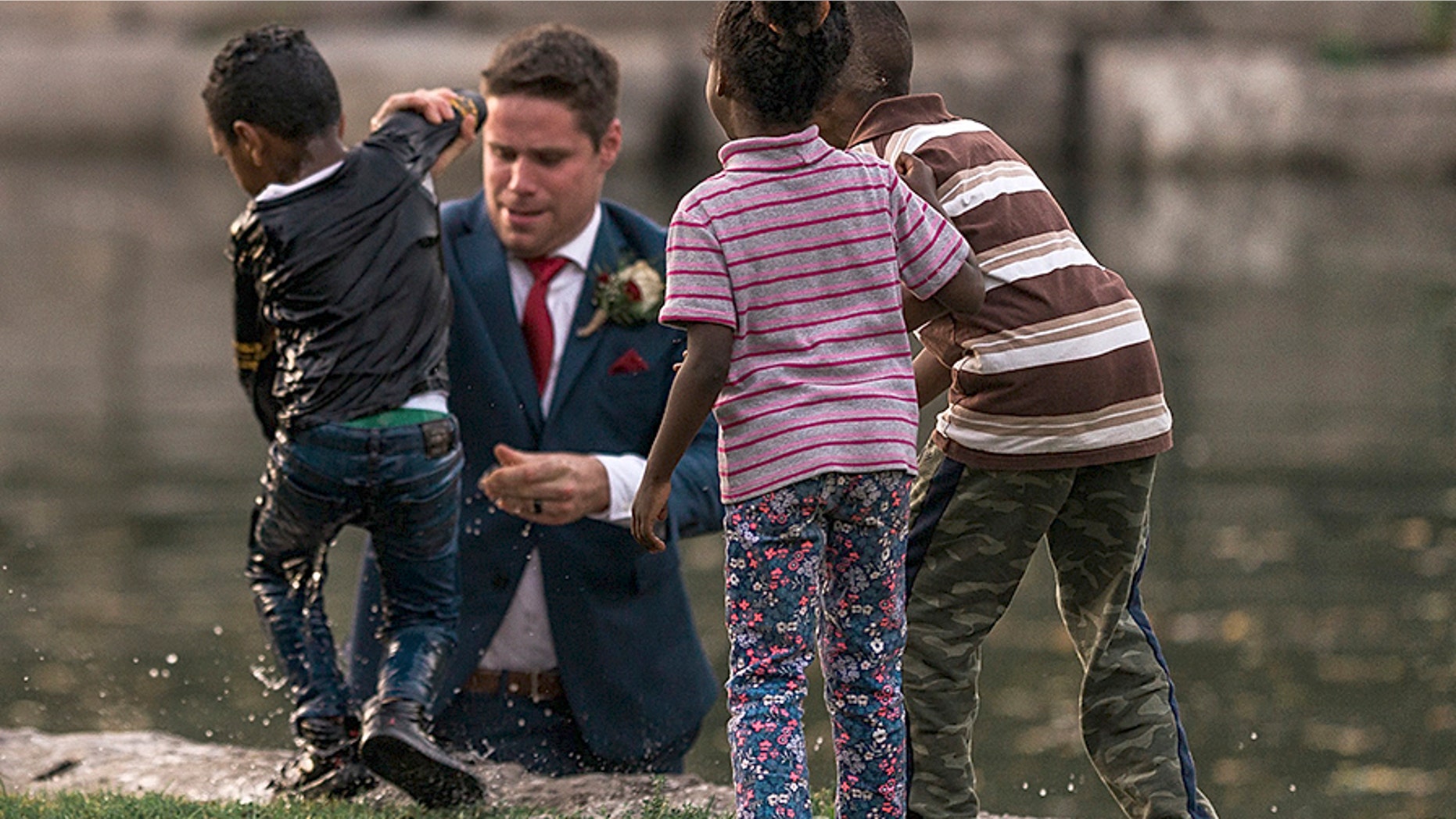 A groom in Canada is being called a hero after he saved a little boy from drowning during his wedding photo shoot