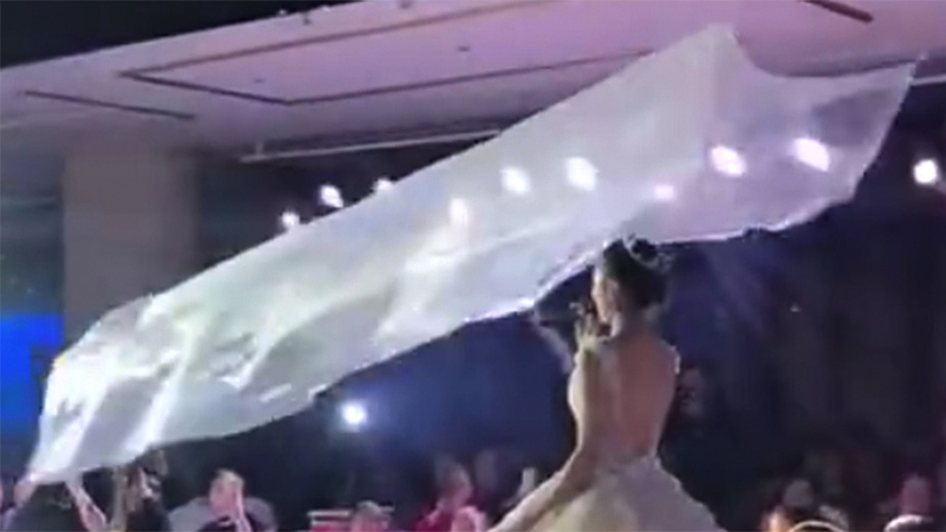 The flying veil trend involves weights, pulleys and ceiling rails.