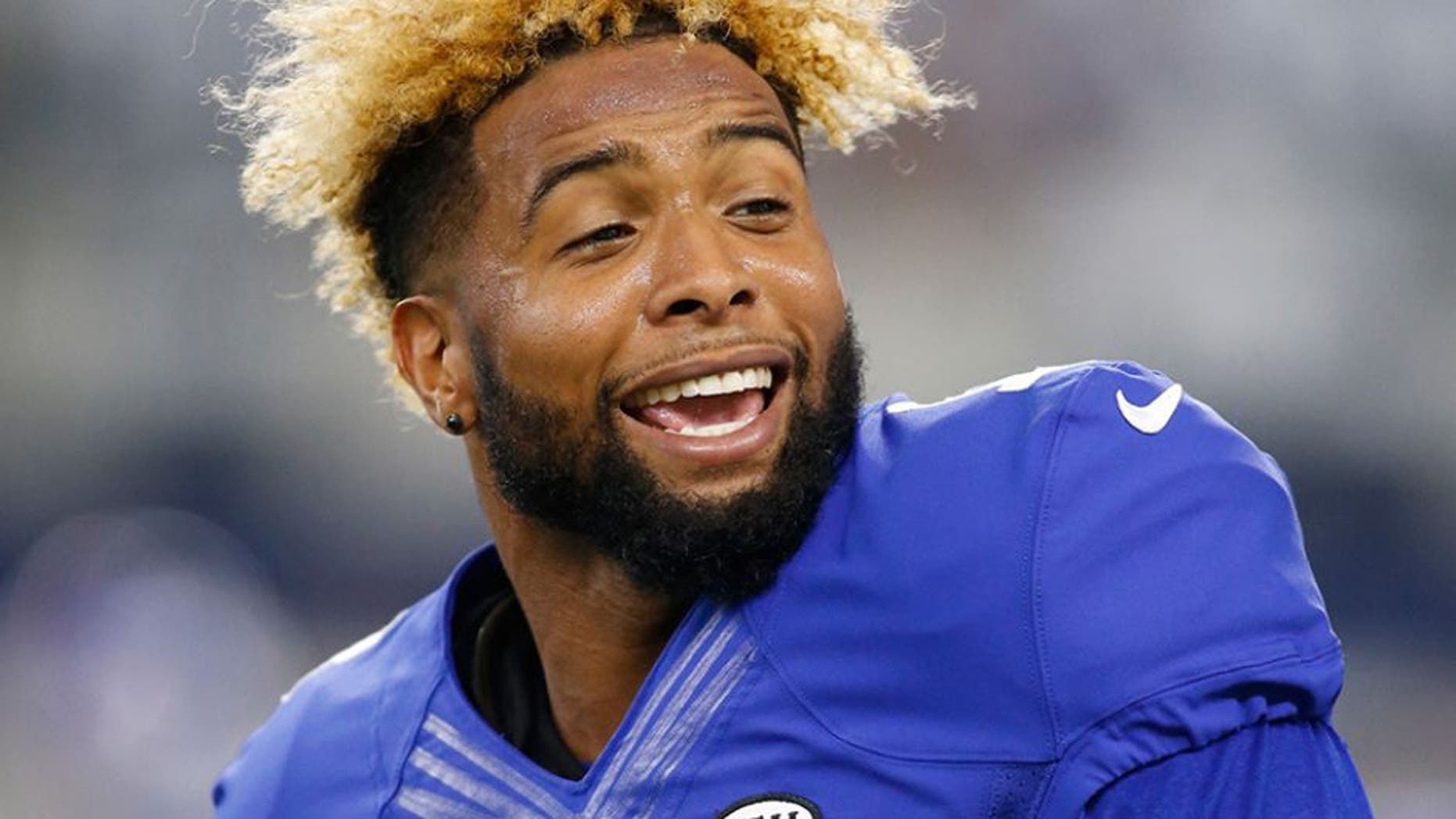 Sep 13, 2015; Arlington, TX, USA; New York Giants wide receiver Odell Beckham (13) smiles on the field prior to the game against the Dallas Cowboys at AT&T Stadium. Mandatory Credit: Tim Heitman-USA TODAY Sports