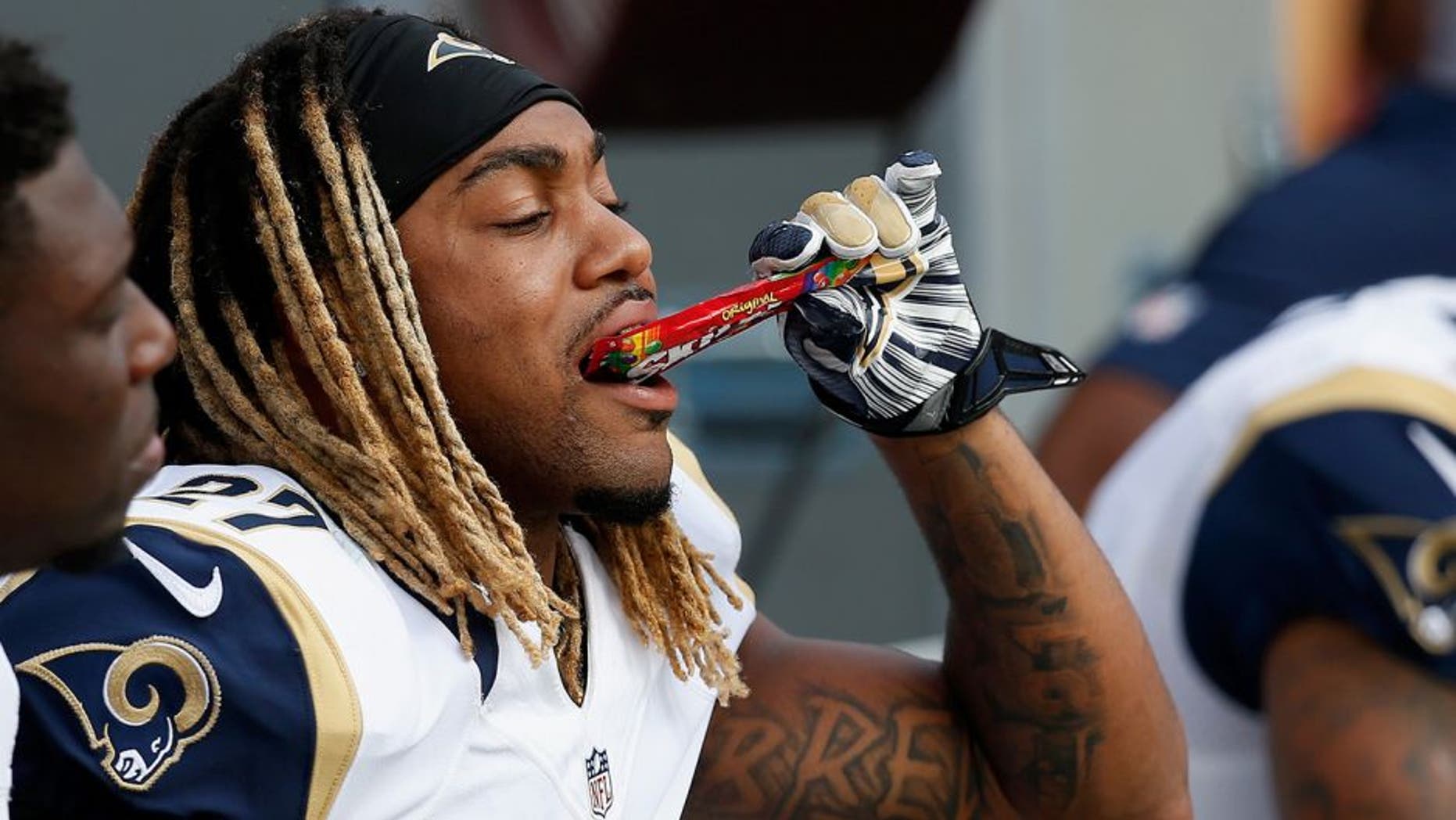 LANDOVER, MD - SEPTEMBER 20: Tre Mason #27 of the St. Louis Rams eats candy on the sidelines during the second half against the Washington Redskins at FedExField on September 20, 2015 in Landover, MD. (Photo by Rob Carr/Getty Images)