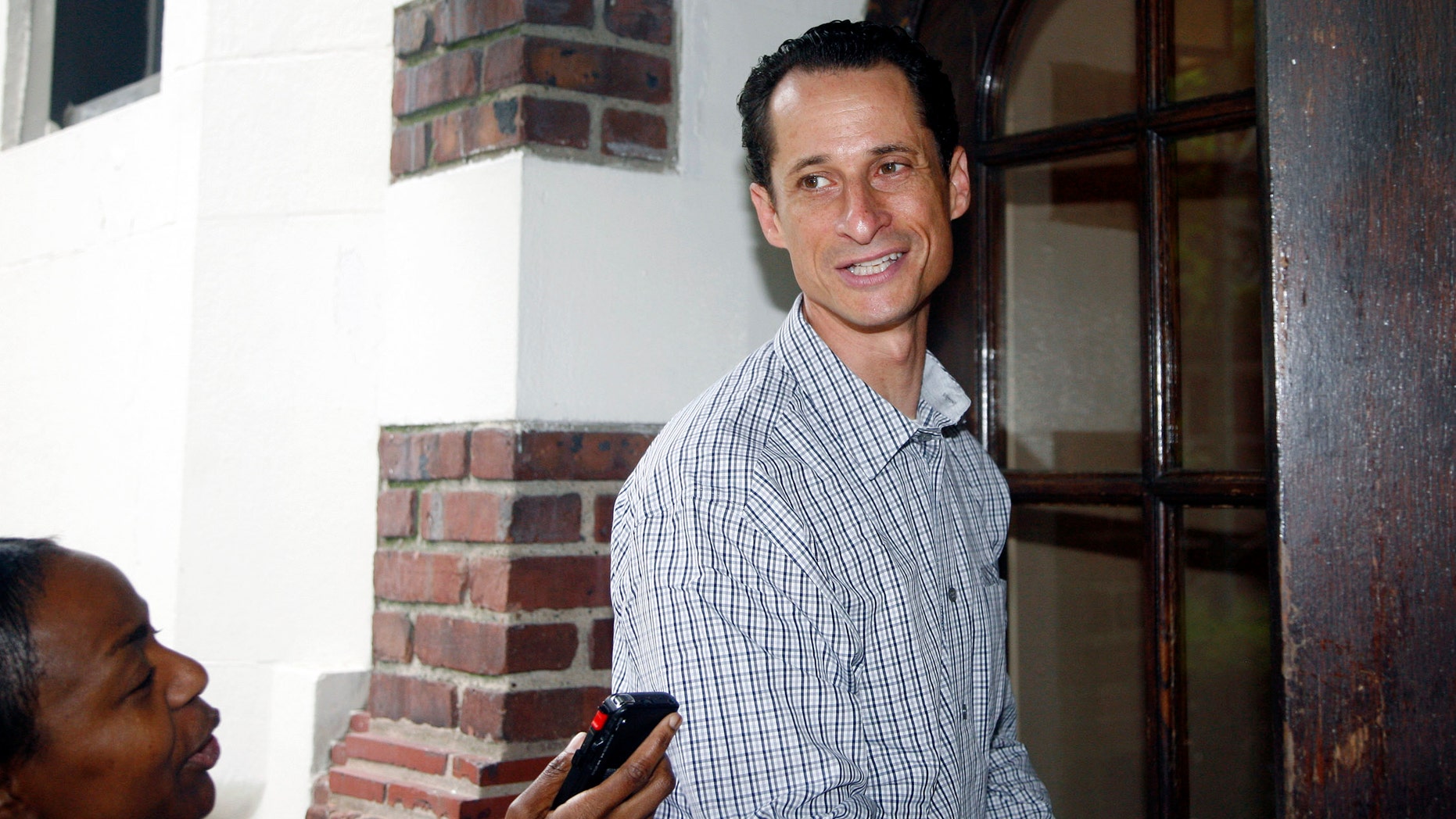 Saturday: Rep. Anthony Weiner, D-N.Y., enters his home in New York after running errands in his neighborhood.