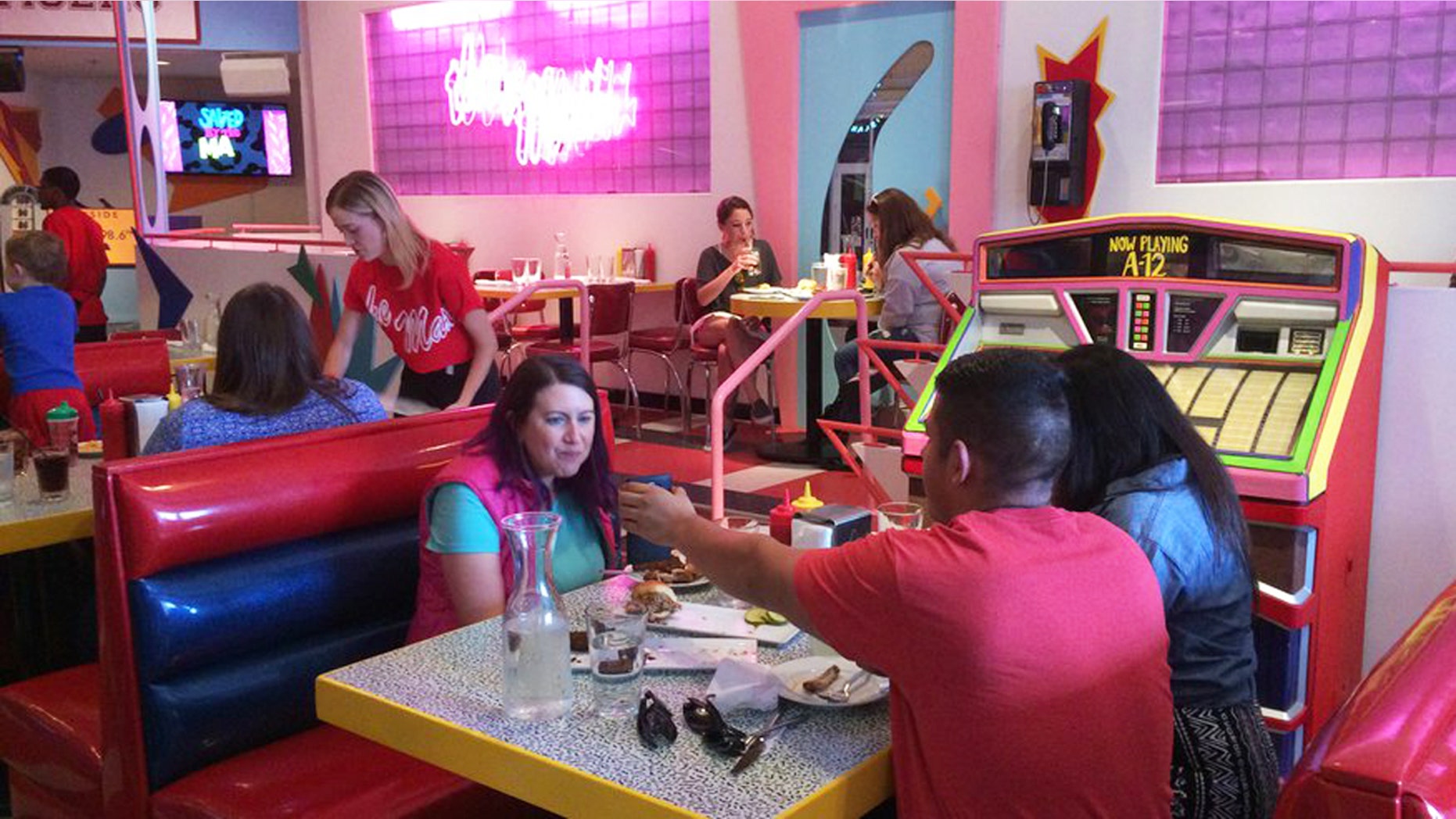 Customers eat at pop-up restaurant Saved by the Max in Chicago. The space is inspired by The Max, the fictitious hangout from the TV sitcom "Saved by the Bell."