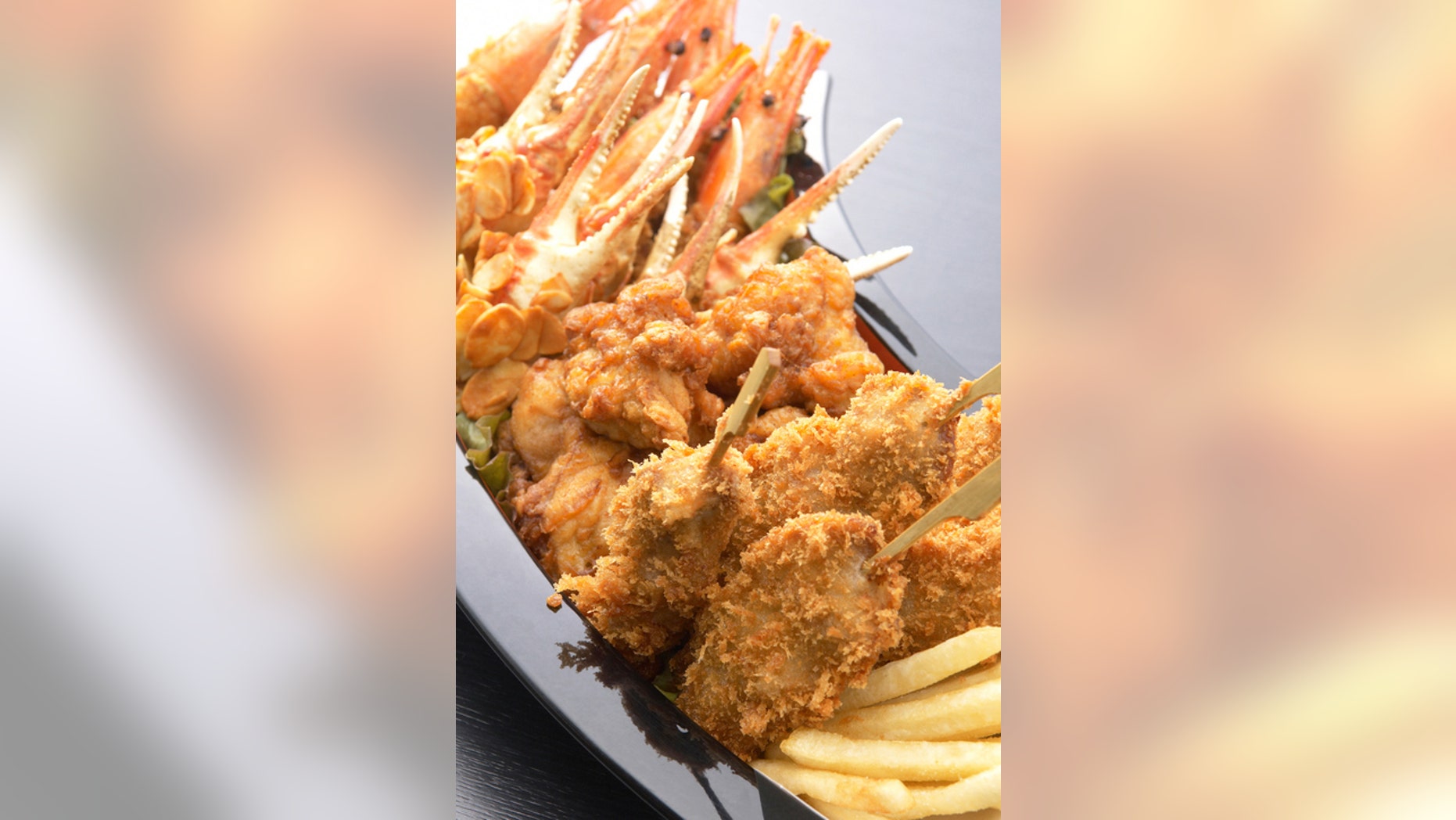 Kushikatsu, deep-fried meat and vegetable skewers, are a very popular street food in Japan.