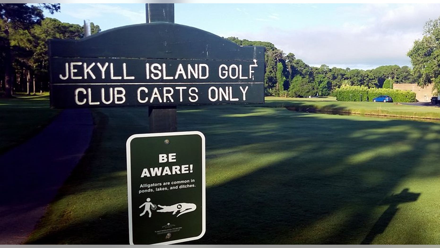 A sign warns golfers to “Be Aware” of alligators on Jekyll Island, Georgia. The state park recently placed roughly 30 signs at golf course entrances, ponds and ditches to make sure visitors know the island is home to an abundance of alligator populations.