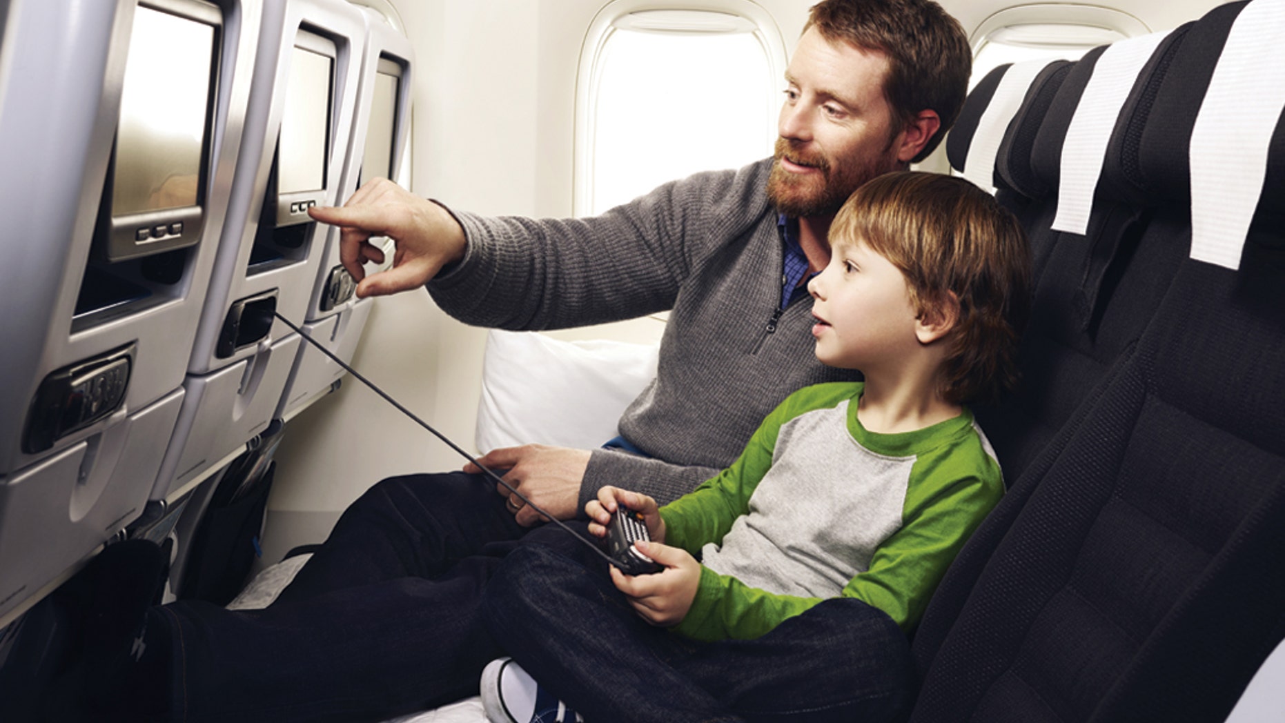 Families can cuddle up on Air New Zealand's Economy Skycouch seating.