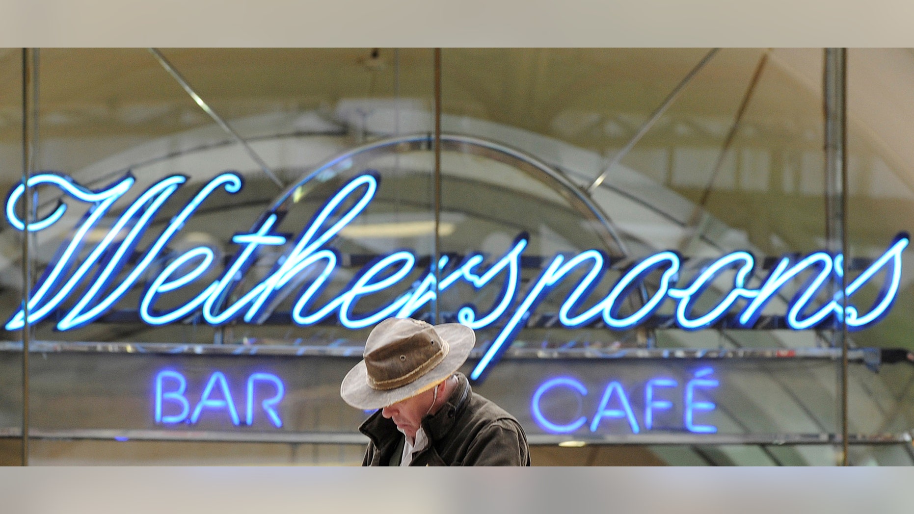 FILE PHOTO: A Wetherspoon's logo is seen at a bar in central London March 13, 2009. (REUTERS/Toby Melville//File Photo)