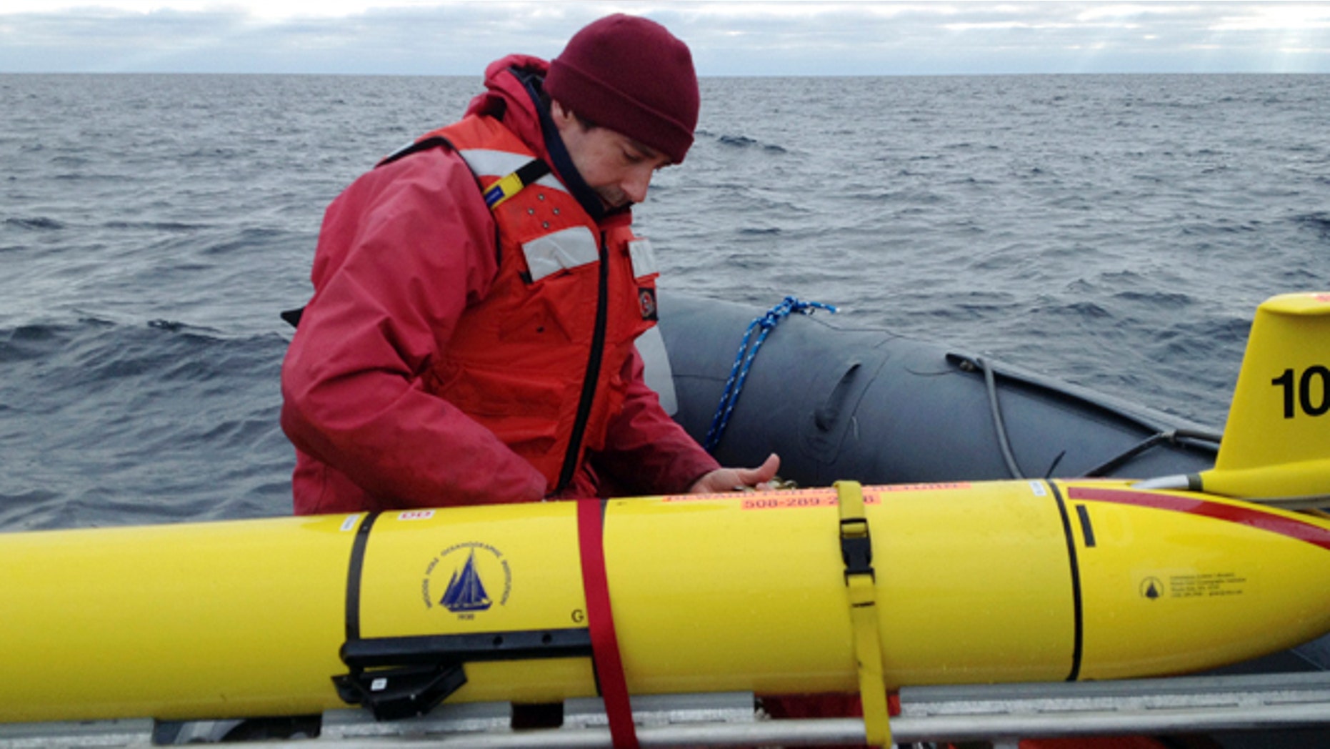 Dec. 4, 2012: Woods Hole Oceanographic Institution chief scientist Mark Baumgartner, secures an underwater robot used to collect acoustic data to help scientists locate endangered whales in the north Atlantic Ocean.