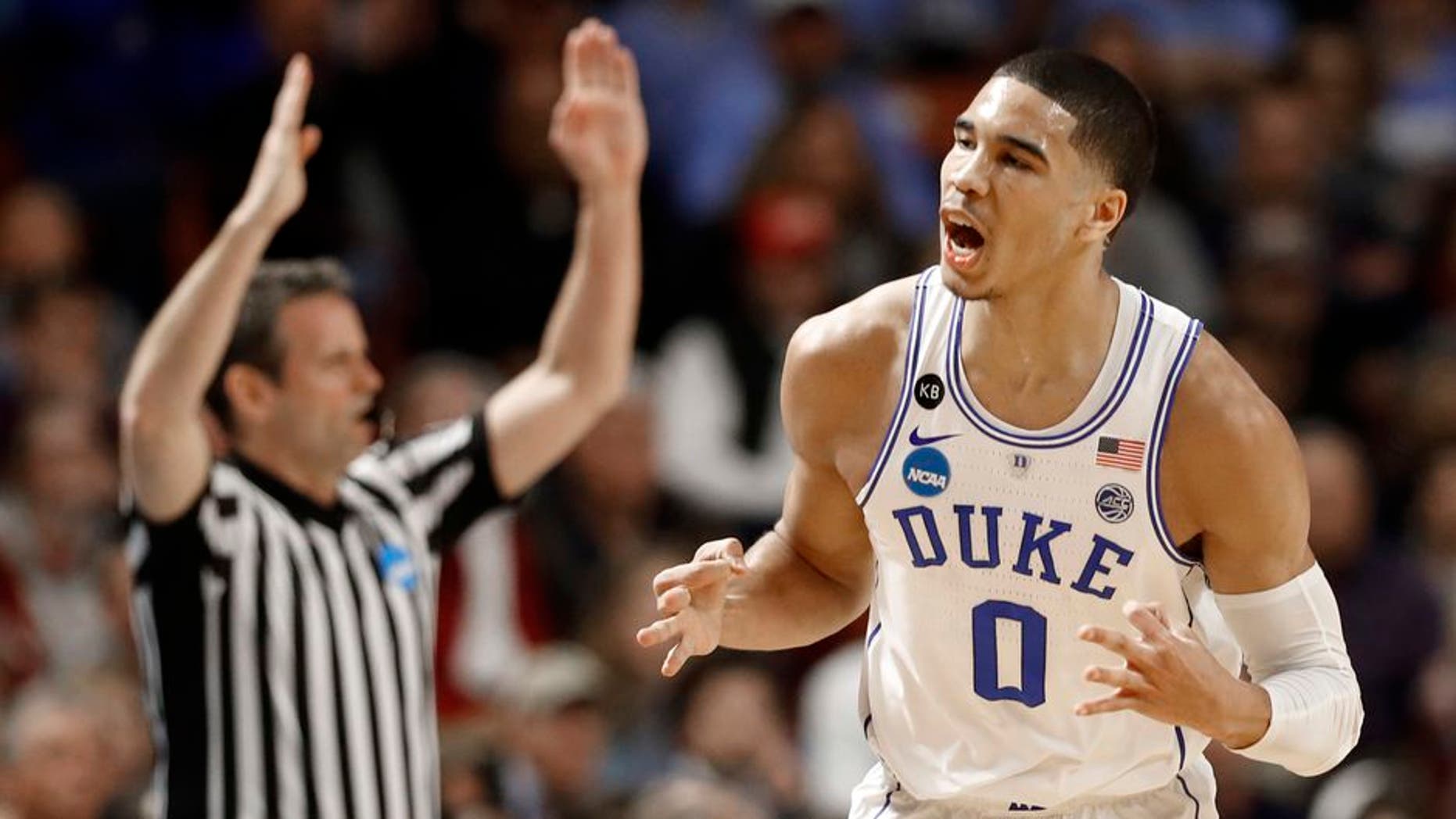 Duke's Jayson Tatum (0) reacts to making a three-point basket against South Carolina during the first half in a second-round game of the NCAA men's college basketball tournament in Greenville, S.C., Sunday, March 19, 2017. (AP Photo/Chuck Burton)