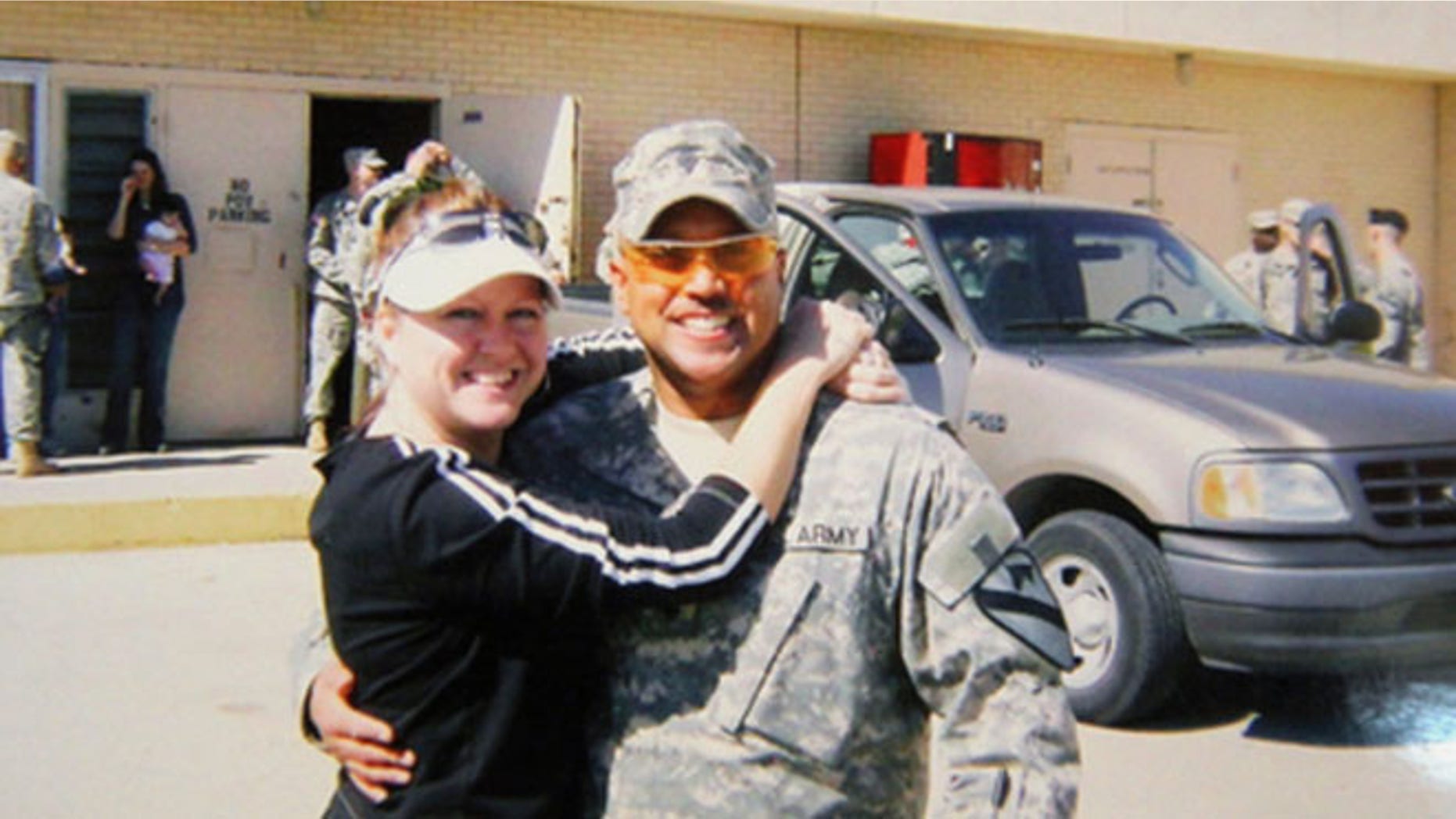 Sept. 22, 2014: Omar Gonzalez poses for a photo in his Army uniform with his former wife Samantha, prior to an overseas deployment.