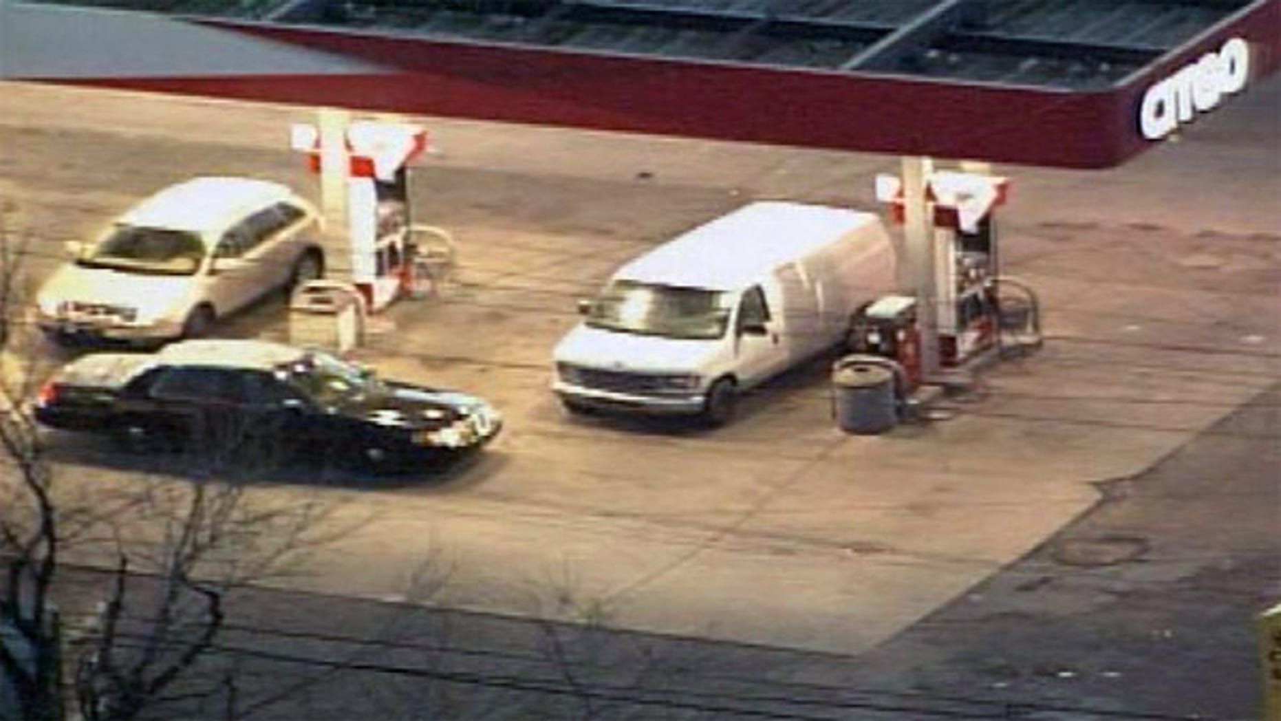 Detroit police searched this white van Tuesday to discover an empty casket in the back.