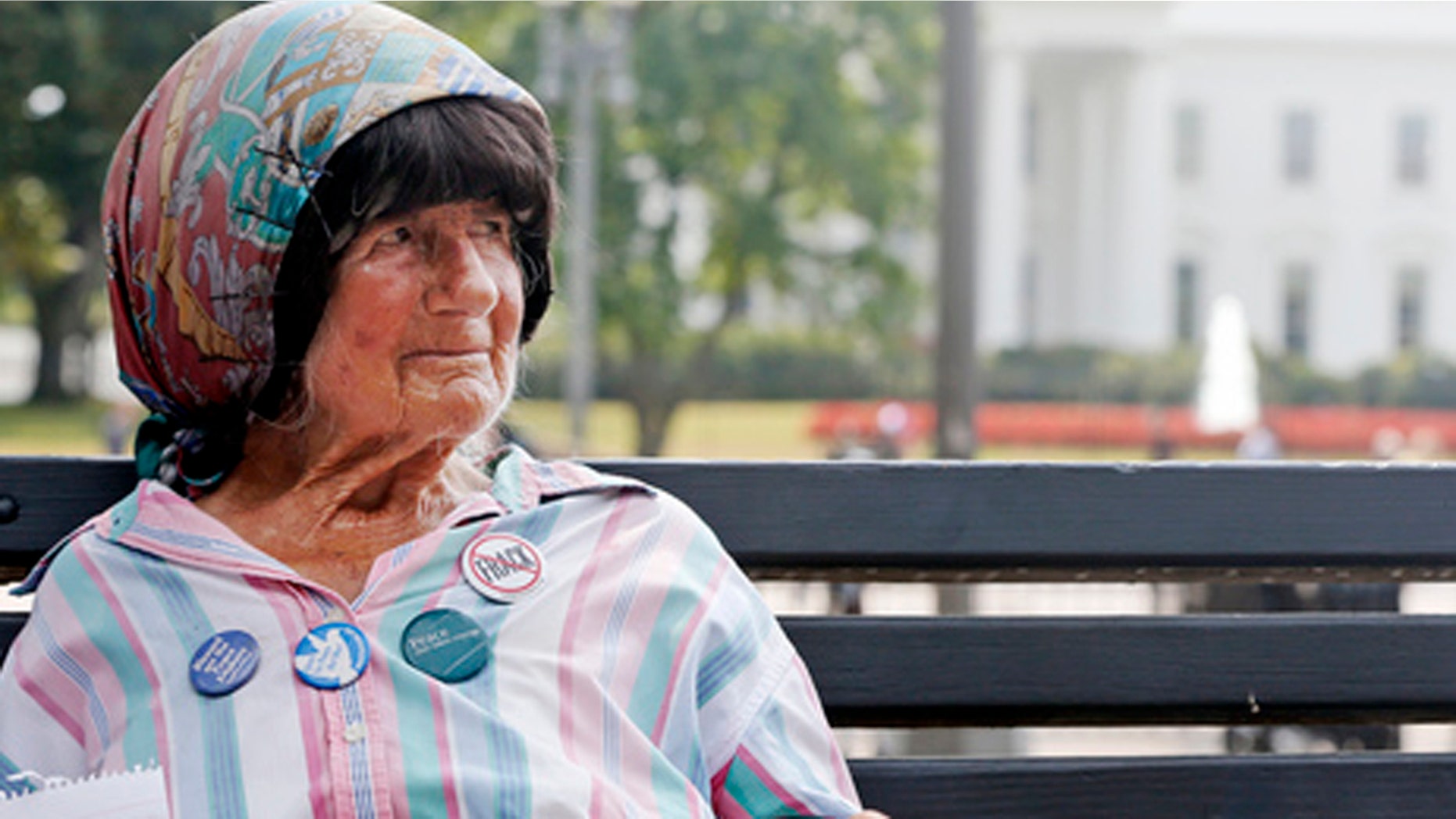 Sept. 12, 2013: Protester Concepcion Picciotto, who held a constant peace vigil in Lafayette Park across from the White House since 1981, sits on a park bench. (AP Photo/Charles Dharapak)