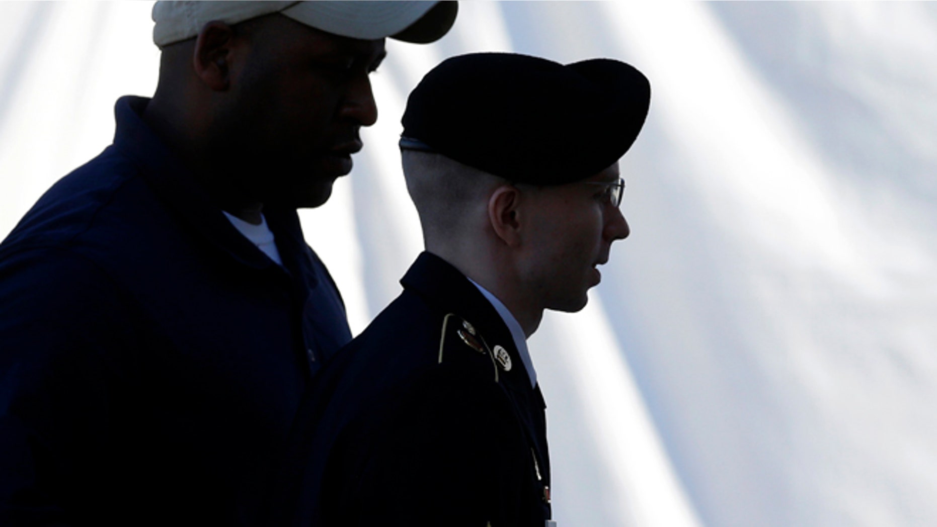 JUNE 4: Army Pfc. Bradley Manning is escorted into a courthouse in Fort Meade, Md.