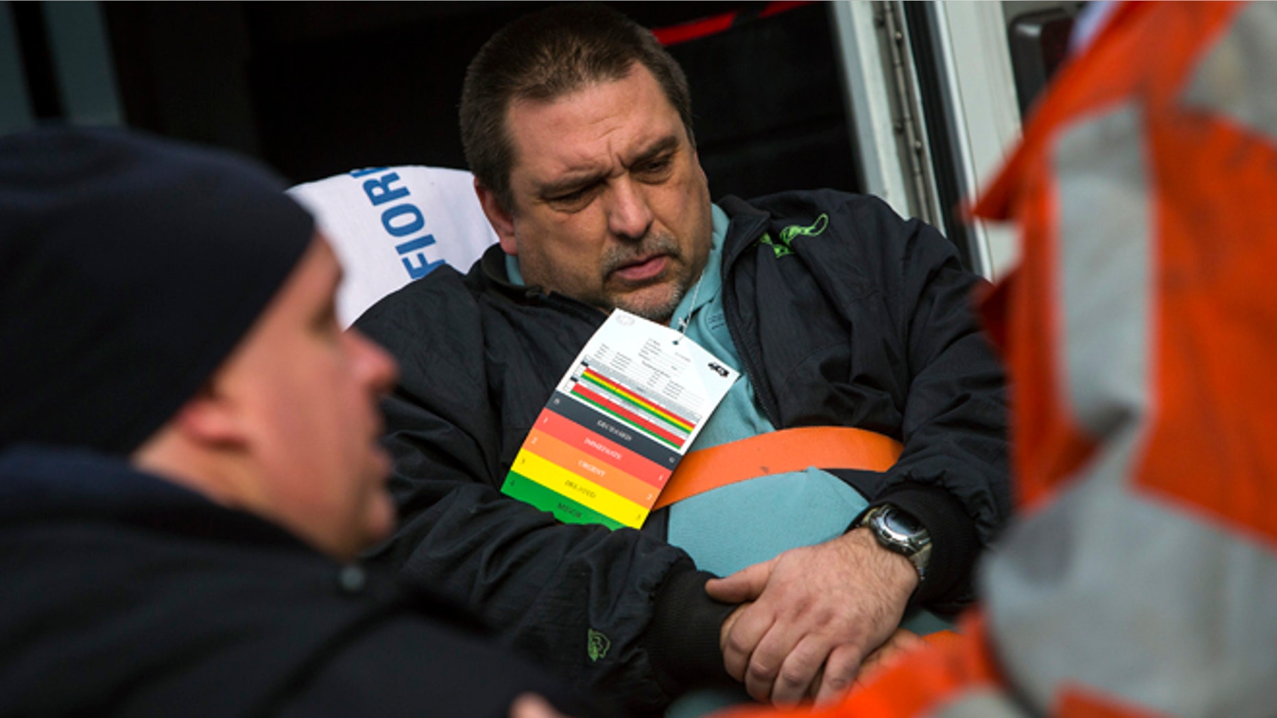Dec. 1, 2013: Metro-North engineer William Rockefeller is loaded into an ambulance after a train derailment in the Bronx borough of New York.