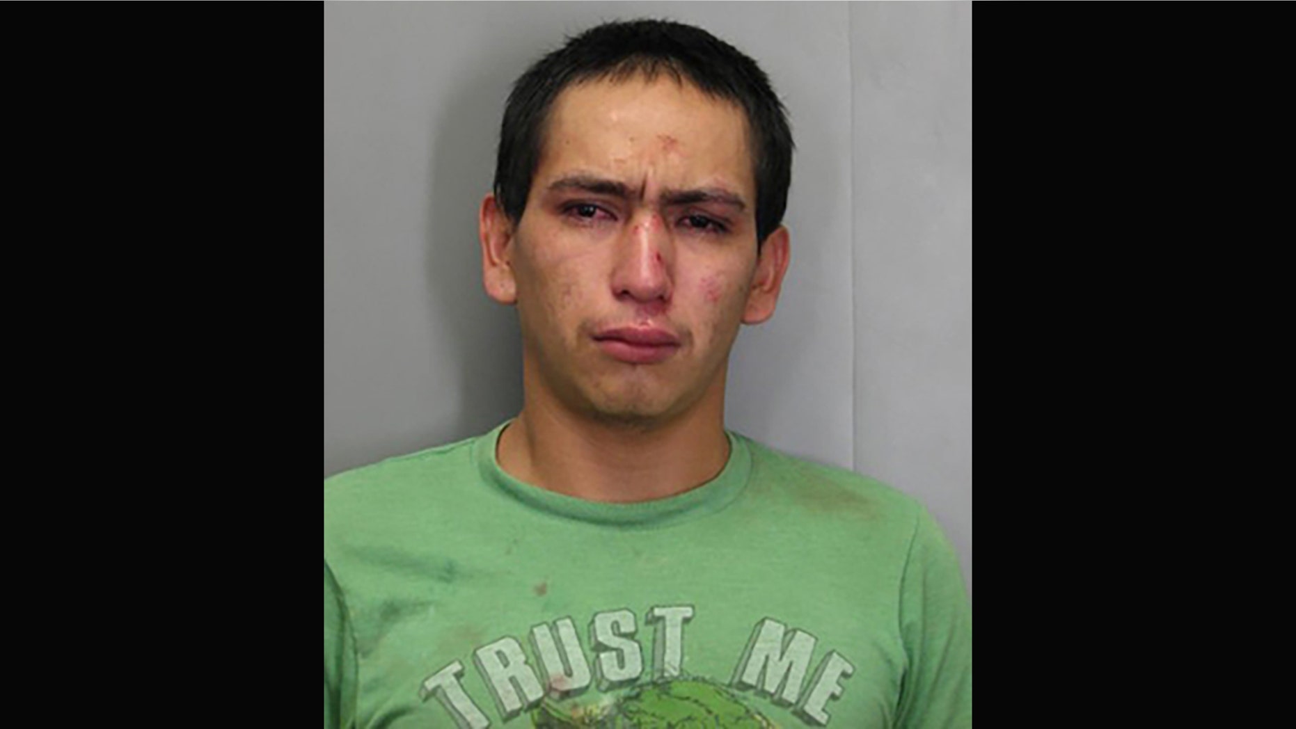 Wilmer Garcia, is accused of stealing a car while wearing a "Trust Me" t-shirt.
